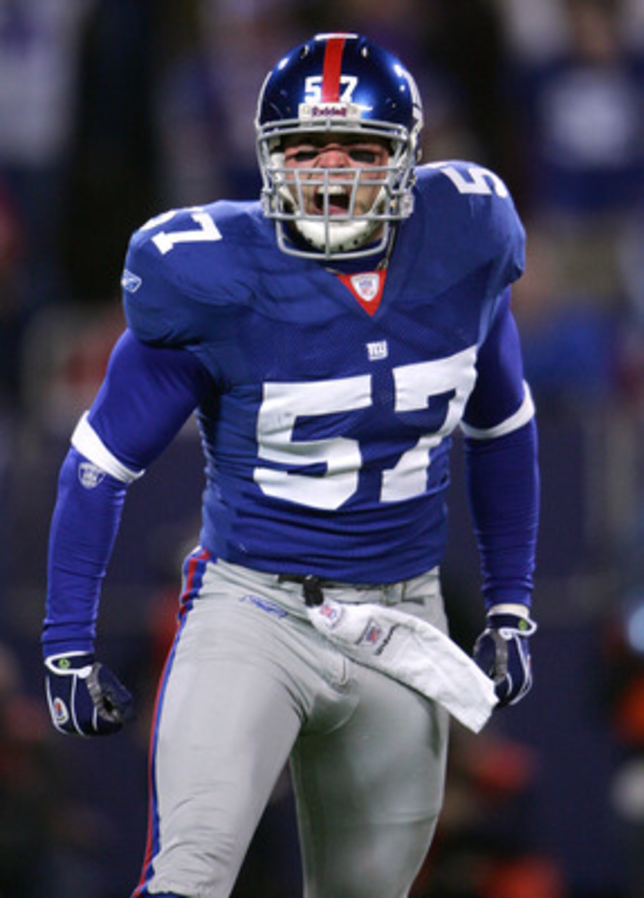EAST RUTHERFORD, NJ - DECEMBER 29: Chase Blackburn #57 of the New York Giants celebrates after a play against the New England Patriots on December 29, 2007 at Giants Stadium in East Rutherford, New Jersey. (Photo by Chris McGrath/Getty Images) EAST RUTHERFORD, NJ - DECEMBER 29: Chase Blackburn #57 of the New York Giants celebrates after a play against the New England Patriots on December 29, 2007 at Giants Stadium in East Rutherford, New Jersey. (Photo by Chris McGrath/Getty Images)
