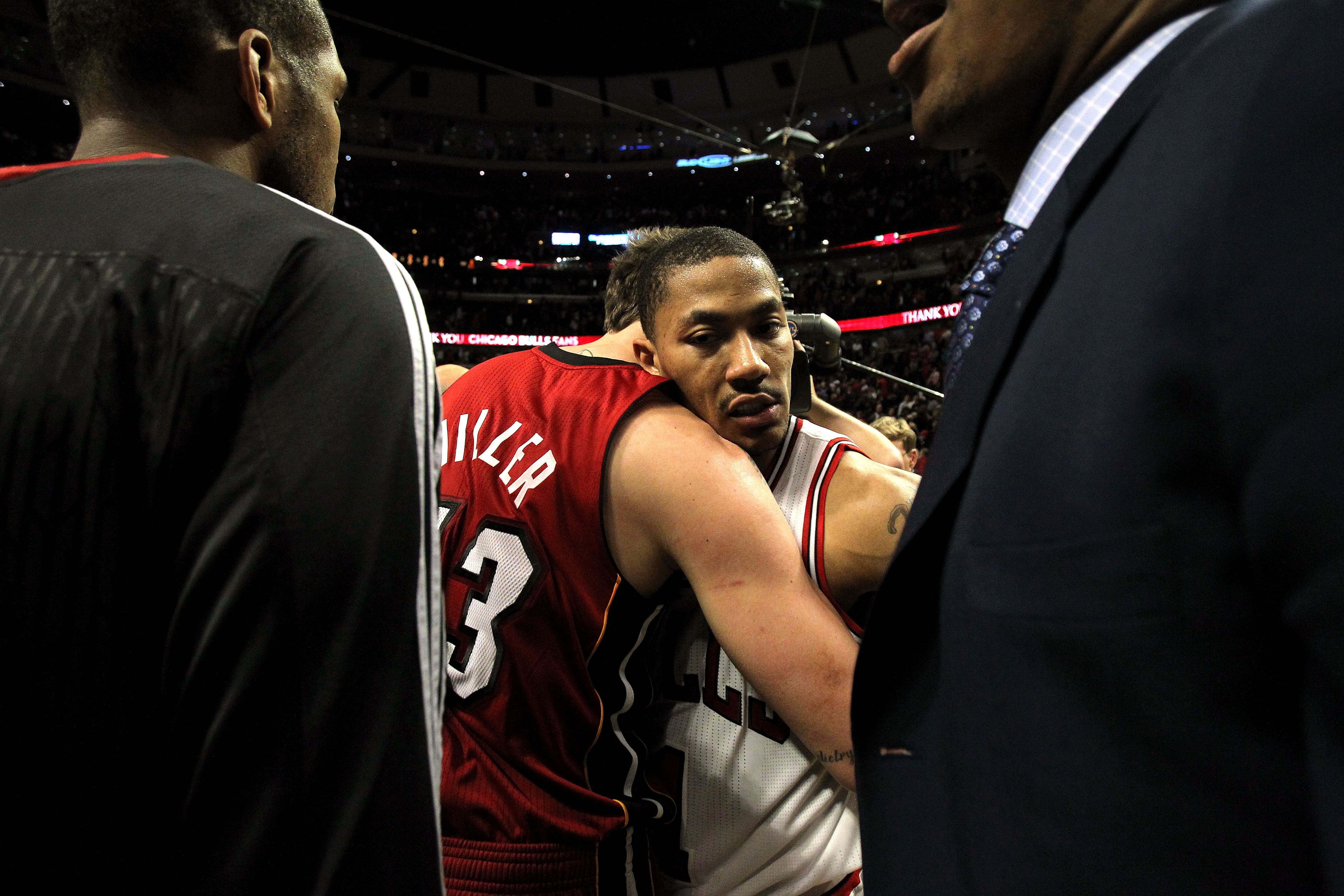 CHICAGO, IL - MAY 26:  Derrick Rose #1 of the Chicago Bulls looks on dejected as he congratulates Mike Miller #13 of the Miami Heat after the Heat won 83-80 in Game Five of the Eastern Conference Finals during the 2011 NBA Playoffs on May 26, 2011 at the