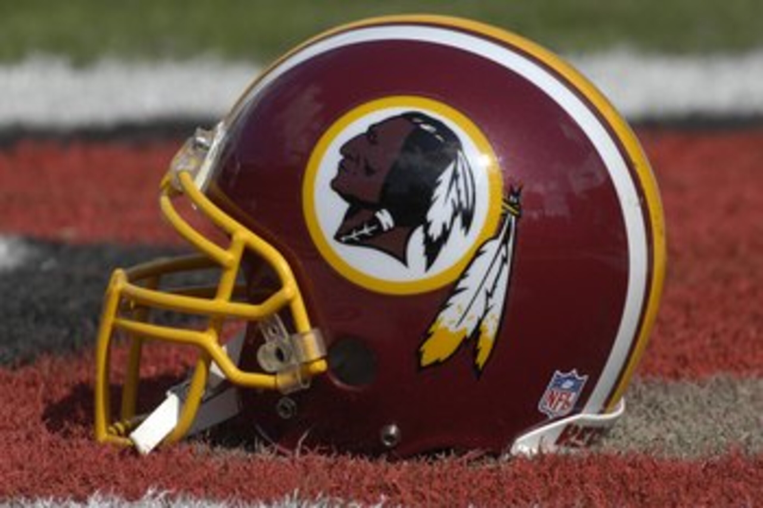 TAMPA, FL - NOVEMBER 25: The helmet of a Washington Redskins player rests on the field during warm ups against the Tampa Bay Buccaneers at the Raymond James Stadium on November 25, 2007 in Tampa, Florida.  The Bucs won 19-13. (Photo by Al Messerschmidt/Ge