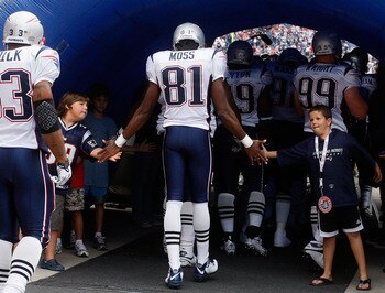 FOXBORO, MA - SEPTEMBER 12: Randy Moss #81 of the New England Patriots enters the field before the NFL season opener against the Cincinnati Bengals at Gillette Stadium on September 12, 2010 in Foxboro, Massachusetts. (Photo by Jim Rogash/Getty Images)