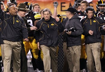 TEMPE, AZ - DECEMBER 28:  Head coach Kirk Ferentz (C) of the Iowa Hawkeyes celebrates with teammates after defeating the Missouri Tigers in the Insight Bowl at Sun Devil Stadium on December 28, 2010 in Tempe, Arizona.  The Hawkeyes defeated the Tigers 27-