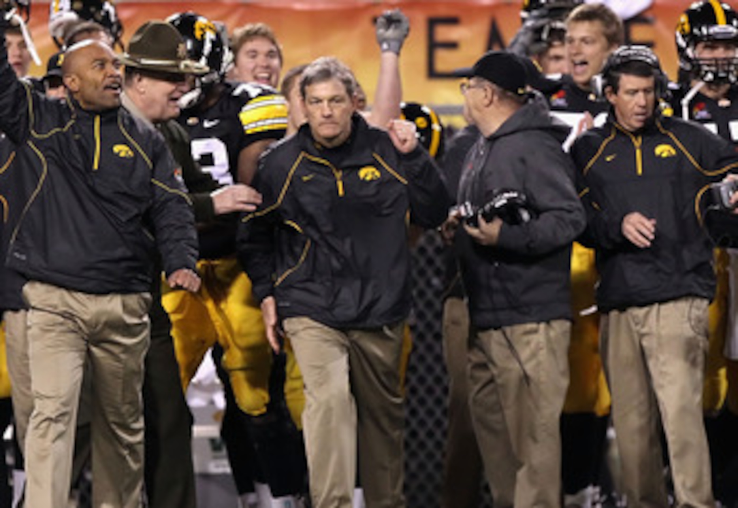 TEMPE, AZ - DECEMBER 28:  Head coach Kirk Ferentz (C) of the Iowa Hawkeyes celebrates with teammates after defeating the Missouri Tigers in the Insight Bowl at Sun Devil Stadium on December 28, 2010 in Tempe, Arizona.  The Hawkeyes defeated the Tigers 27-