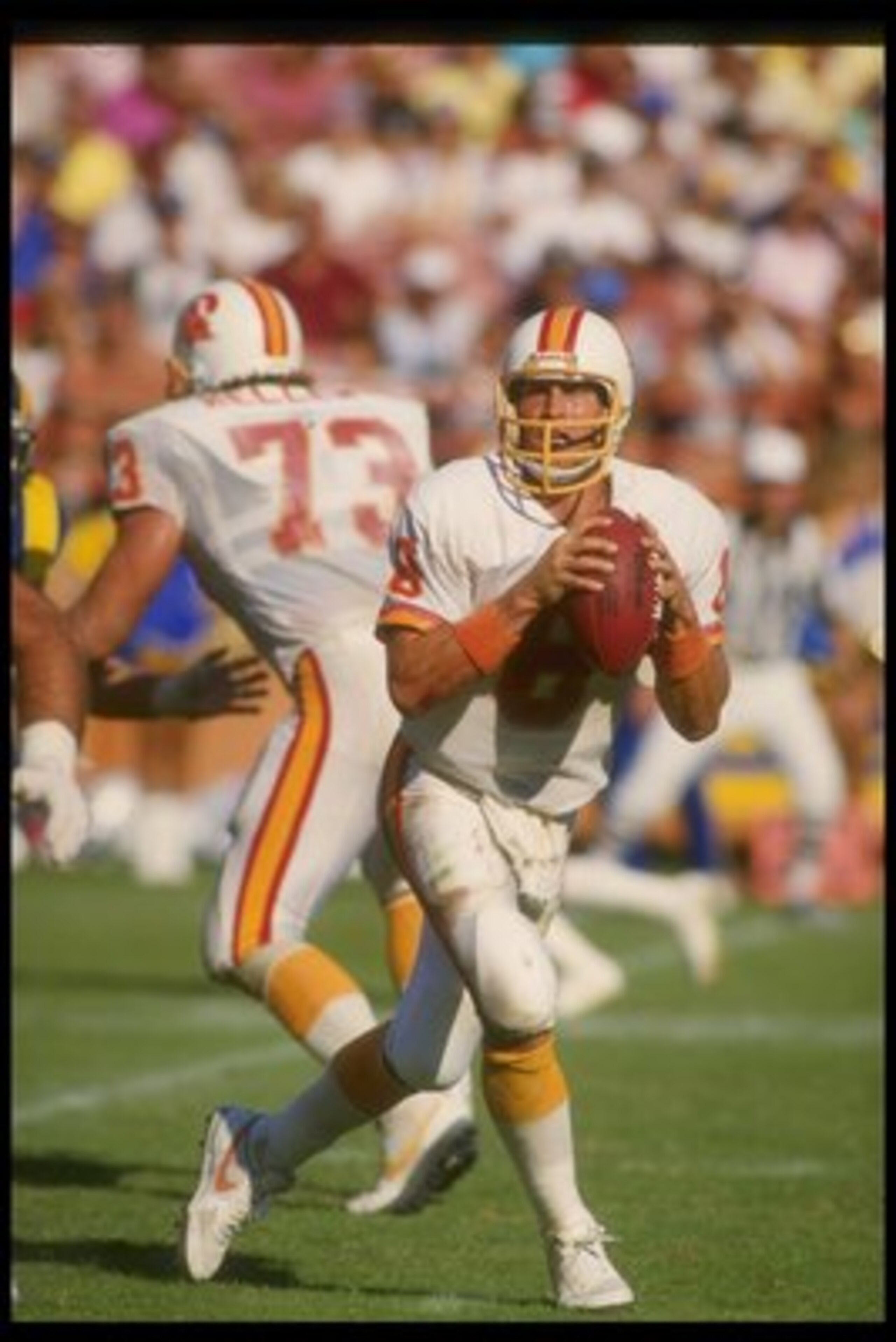5 Oct 1986:  Quarterback Steve Young of the Tampa Bay Buccaneers looks to pass the ball during a game against the Los Angeles Rams at Anaheim Stadium in Anaheim, California.  The Rams won the game, 26-20. Mandatory Credit: Rick Stewart  /Allsport