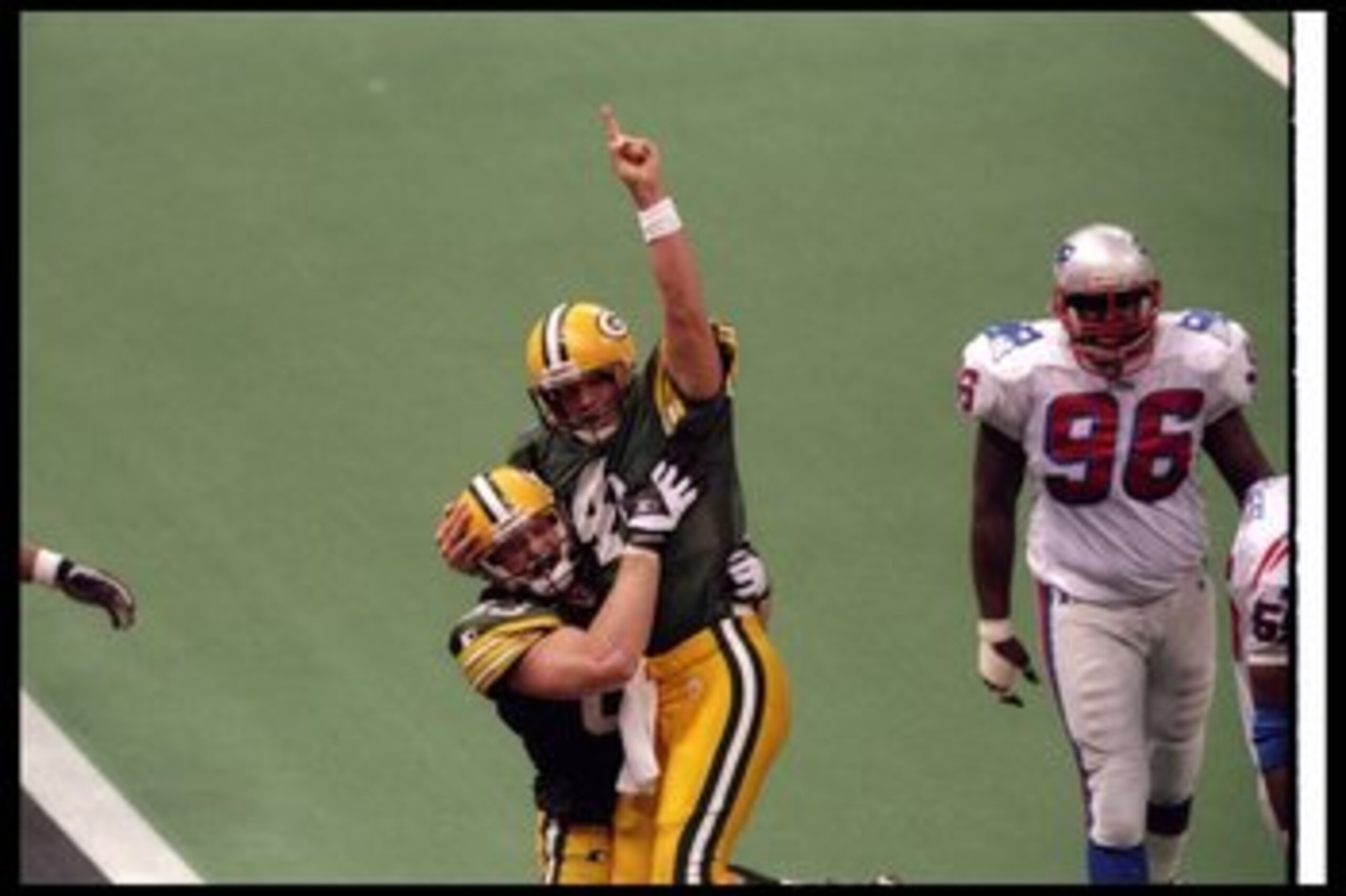 26 Jan 1997:  Quarterback Brett Favre of the Green Bay Packers celebrates with teammate tight end Jeff Thomason during Super Bowl XXXI against the New England Patriots at the Superdome in New Orleans, Louisiana.  The Packers won the game, 35-21. Mandatory