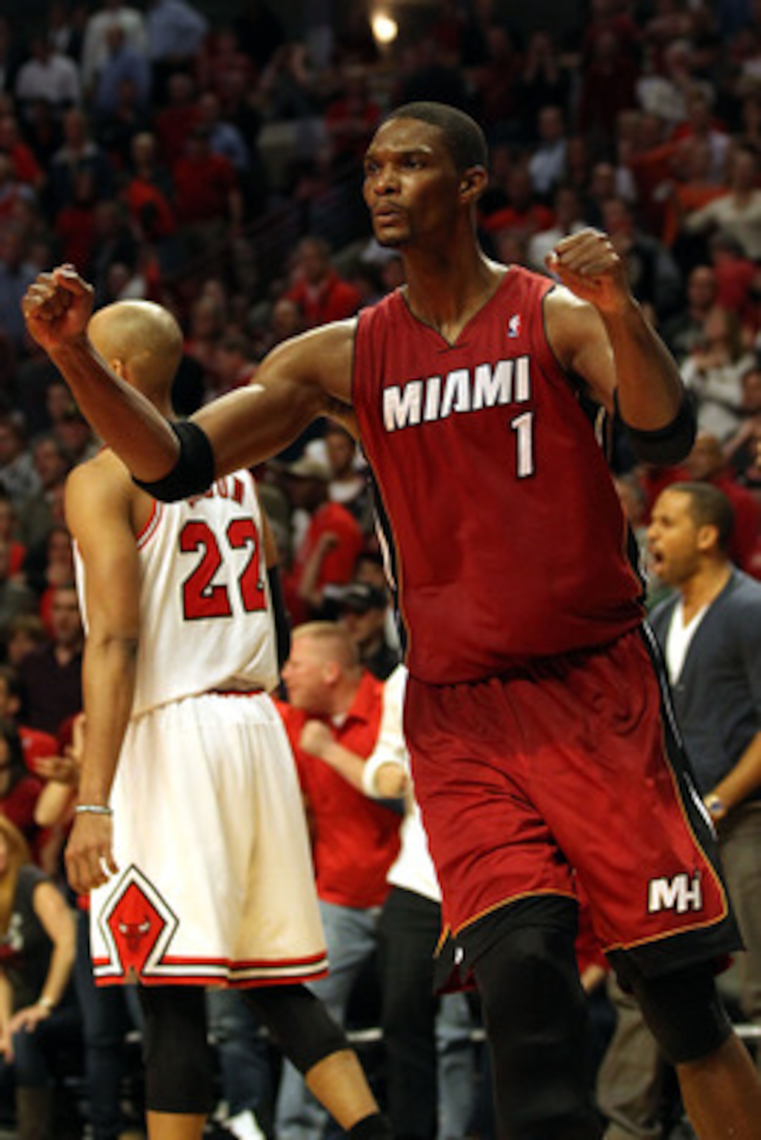 CHICAGO, IL - MAY 26:  Chris Bosh #1 of the Miami Heat celebrates after the Heat won 83-80 against the Chicago Bulls in Game Five of the Eastern Conference Finals during the 2011 NBA Playoffs on May 26, 2011 at the United Center in Chicago, Illinois. NOTE