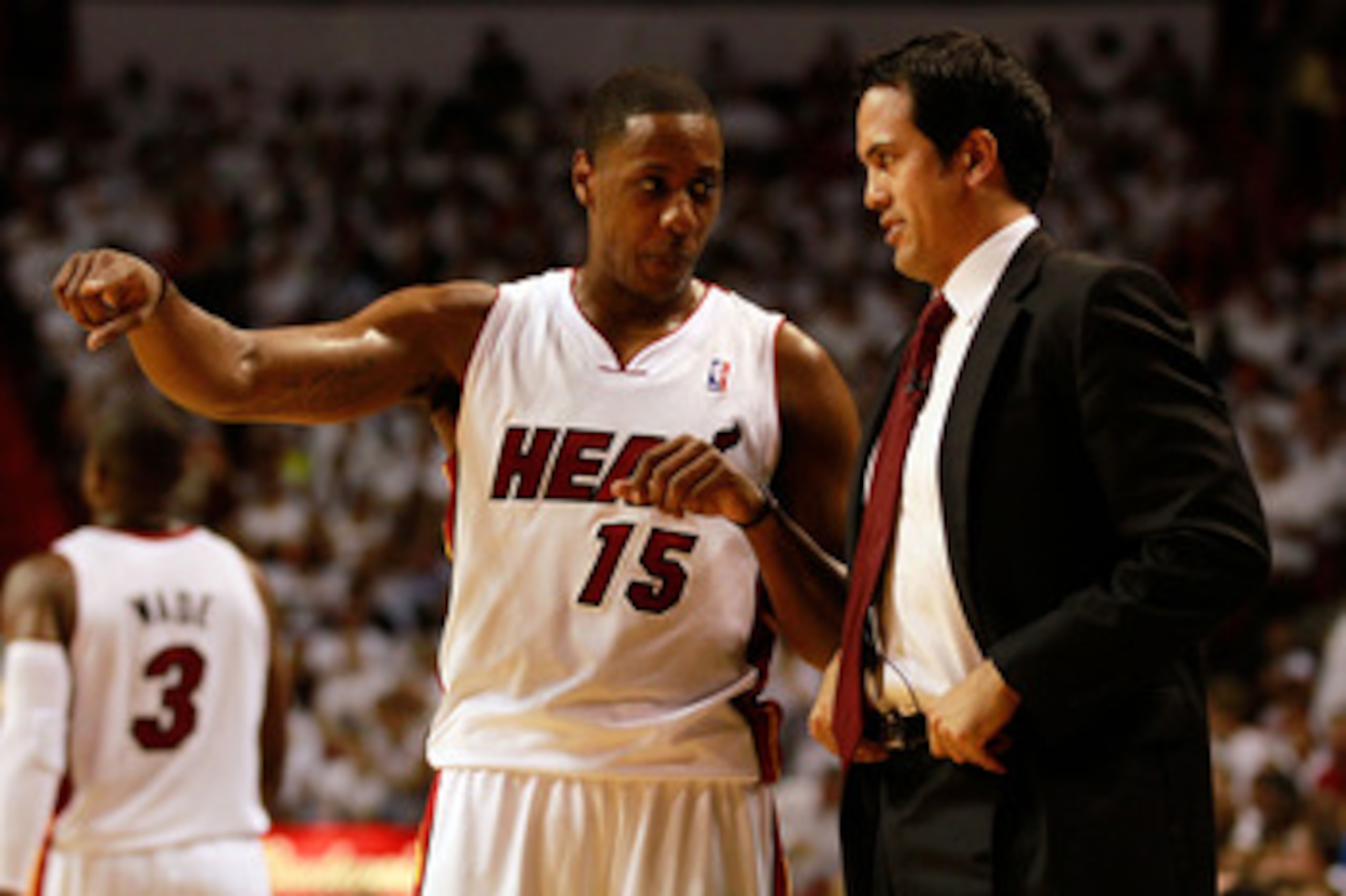 MIAMI, FL - MAY 24:  Head coach Erik Spoelstra of the Miami Heat talks with Mario Chalmers #15 against the Chicago Bulls in Game Four of the Eastern Conference Finals during the 2011 NBA Playoffs on May 24, 2011 at American Airlines Arena in Miami, Florid