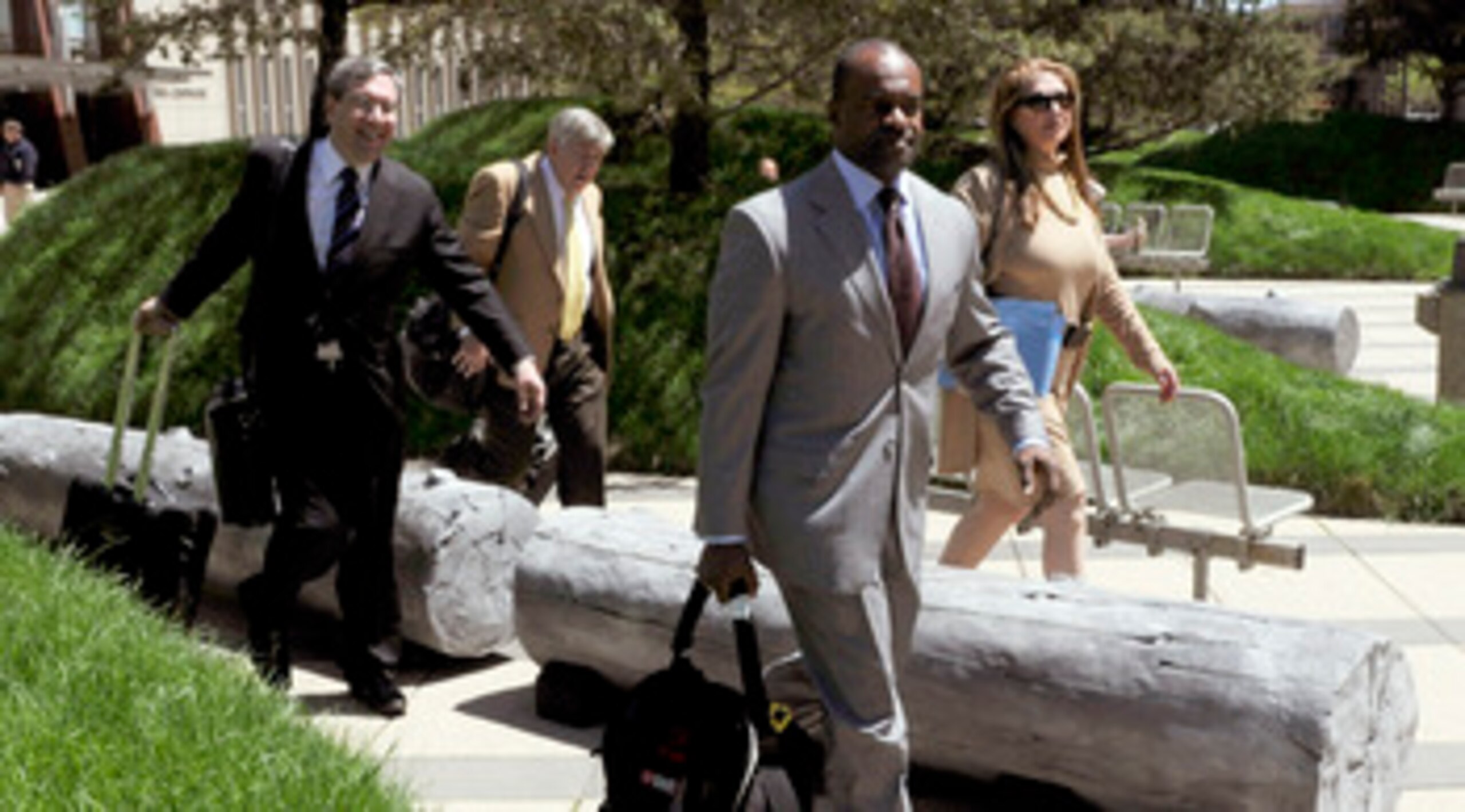 MINNEAPOLIS, MN - MAY 17: NFL players' lawyers Jeffrey Kessler, James Quinn and Barbara P. Berens walk with former NFL Players Association executive director DeMaurice Smith after leaving court ordered mediation at the U.S. Courthouse on May 17, 2011 in M