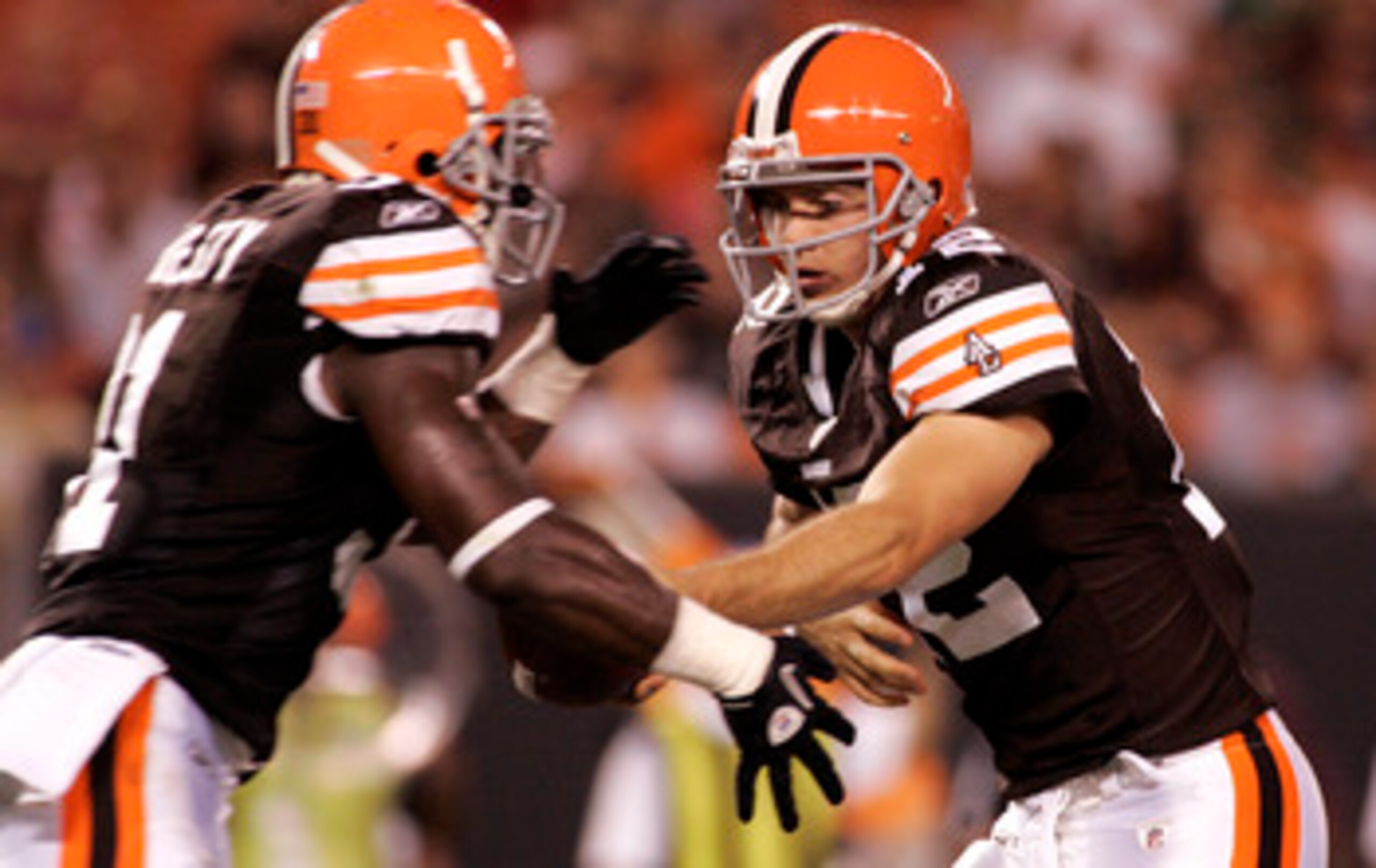 CLEVELAND - SEPTEMBER 2:  Colt McCoy #12 of the Cleveland Browns hands the ball off to Montario Hardesty #31 against the Chicago Bears during the preseason game on September 2, 2010 at Cleveland Browns Stadium in Cleveland, Ohio. The Browns defeated the B