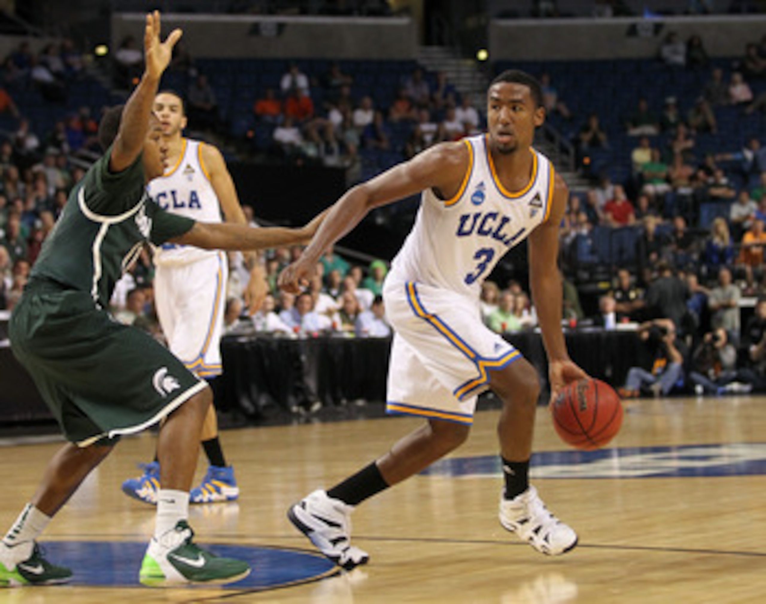 TAMPA, FL - MARCH 17:  Malcolm Lee #3 of the UCLA Bruins looks to pass against the Michigan State Spartans during the second round of the 2011 NCAA men's basketball tournament at St. Pete Times Forum on March 17, 2011 in Tampa, Florida. UCLA won 78-76. (P