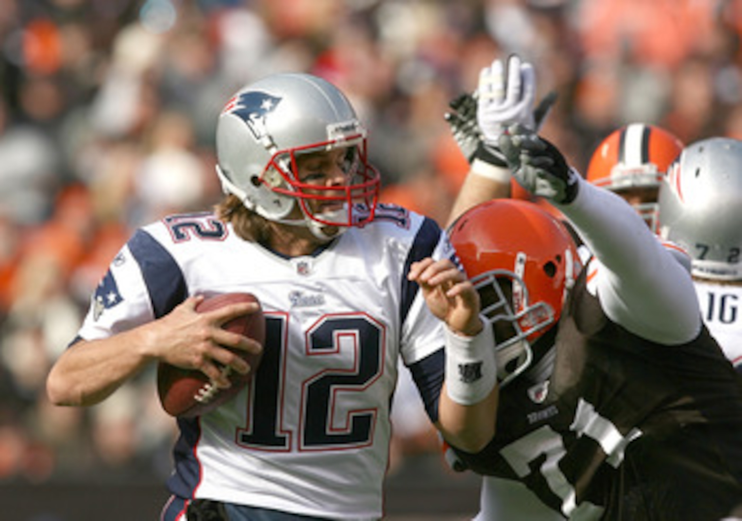CLEVELAND - NOVEMBER 07:  Quarterback Tom Brady #12 of the New England Patriots is sacked by defensive lineman Ahtyba Rubin #71 of the Cleveland Browns at Cleveland Browns Stadium on November 7, 2010 in Cleveland, Ohio.  (Photo by Matt Sullivan/Getty Imag