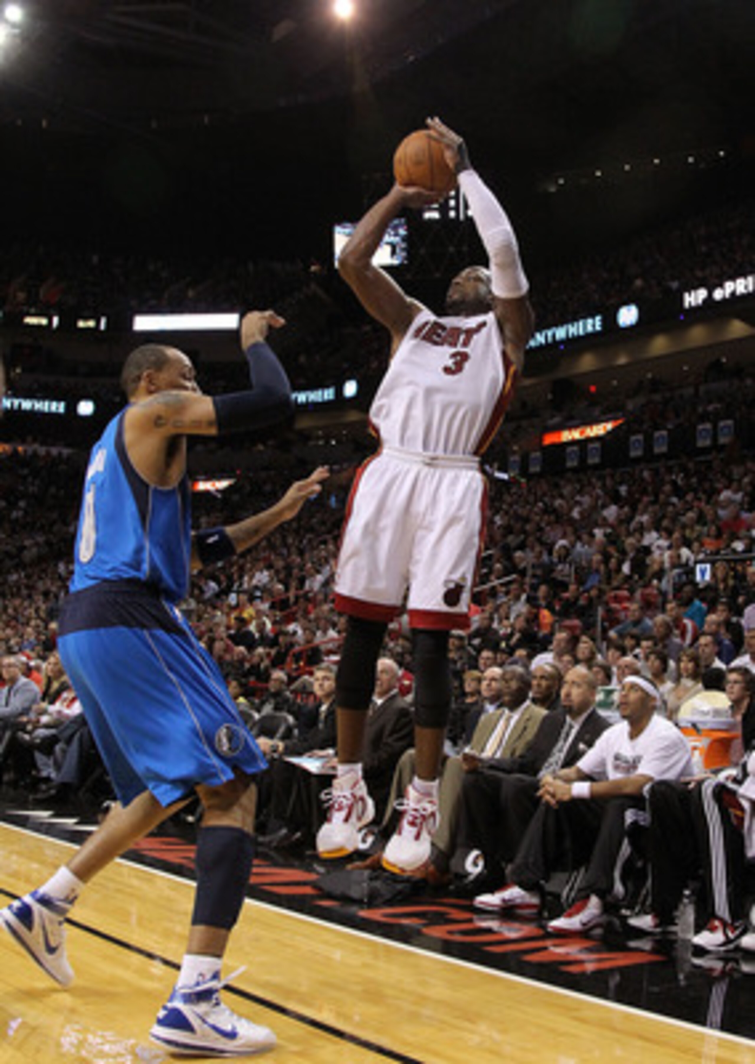 MIAMI, FL - DECEMBER 20: Dwyane Wade #3 of the Miami Heat shoots over Shawn Marion #0 of the Dallas Mavericks during a game at American Airlines Arena on December 20, 2010 in Miami, Florida. NOTE TO USER: User expressly acknowledges and agrees that, by do MIAMI, FL - DECEMBER 20: Dwyane Wade #3 of the Miami Heat shoots over Shawn Marion #0 of the Dallas Mavericks during a game at American Airlines Arena on December 20, 2010 in Miami, Florida. NOTE TO USER: User expressly acknowledges and agrees that, by do