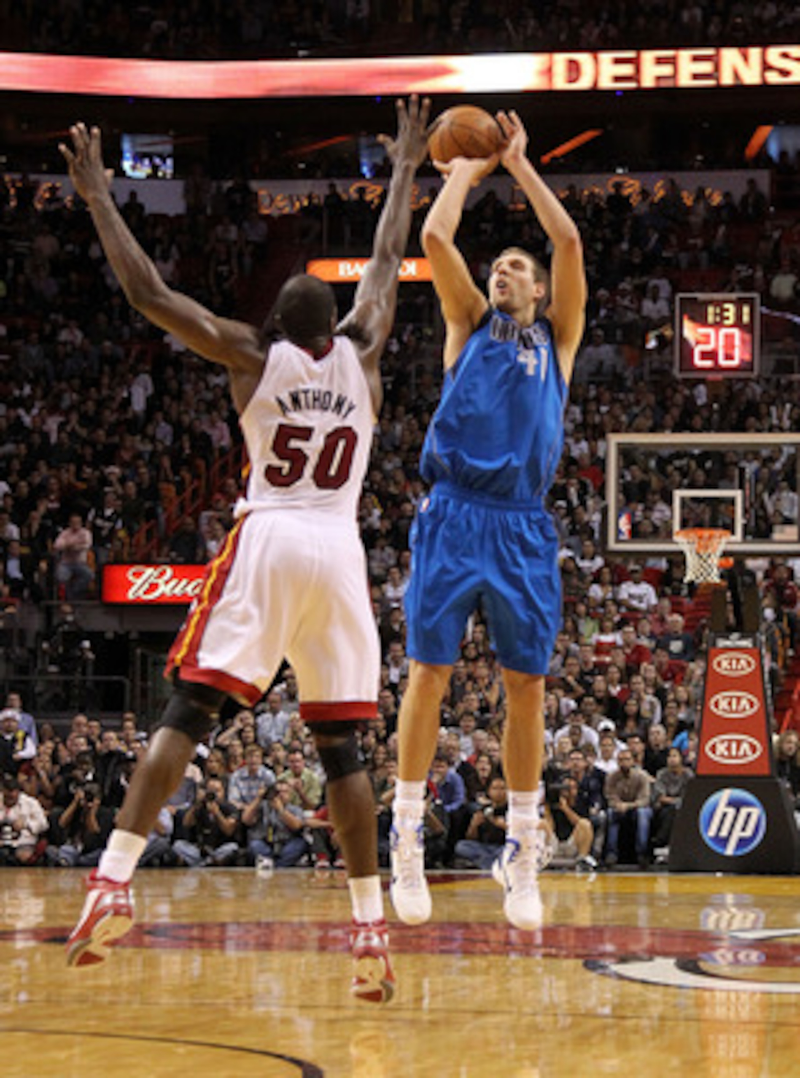 MIAMI, FL - DECEMBER 20: Dirk Nowitzki #41 of the Dallas Mavericks shoots over Joel Anthony #50 of the Miami Heat during a game at American Airlines Arena on December 20, 2010 in Miami, Florida. NOTE TO USER: User expressly acknowledges and agrees that, MIAMI, FL - DECEMBER 20: Dirk Nowitzki #41 of the Dallas Mavericks shoots over Joel Anthony #50 of the Miami Heat during a game at American Airlines Arena on December 20, 2010 in Miami, Florida. NOTE TO USER: User expressly acknowledges and agrees that,