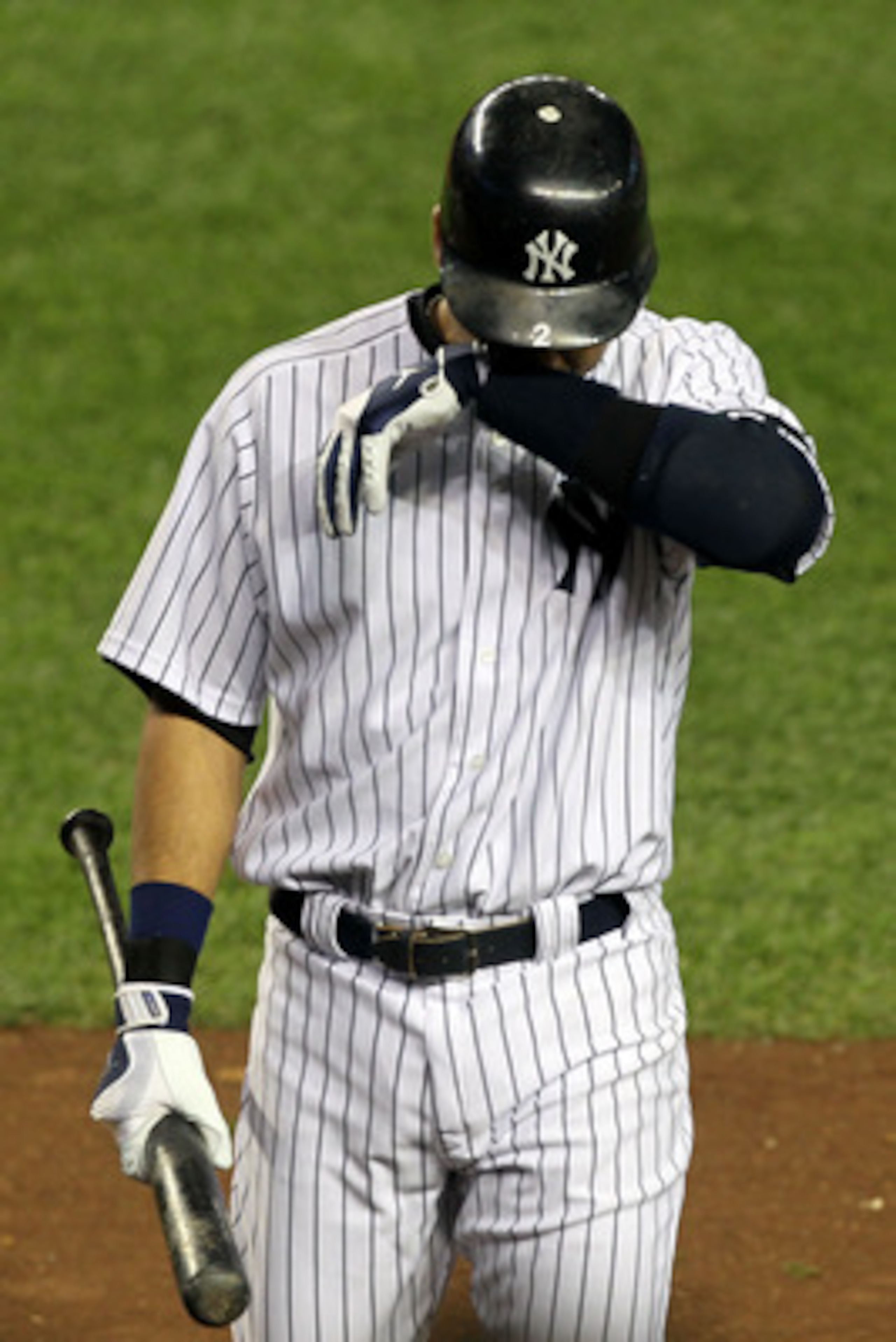 NEW YORK - OCTOBER 18:  Derek Jeter #2 of the New York Yankees reacts after he struck out in the bottom of the sixht inning against the Texas Rangers in Game Three of the ALCS during the 2010 MLB Playoffs at Yankee Stadium on October 18, 2010 in New York,