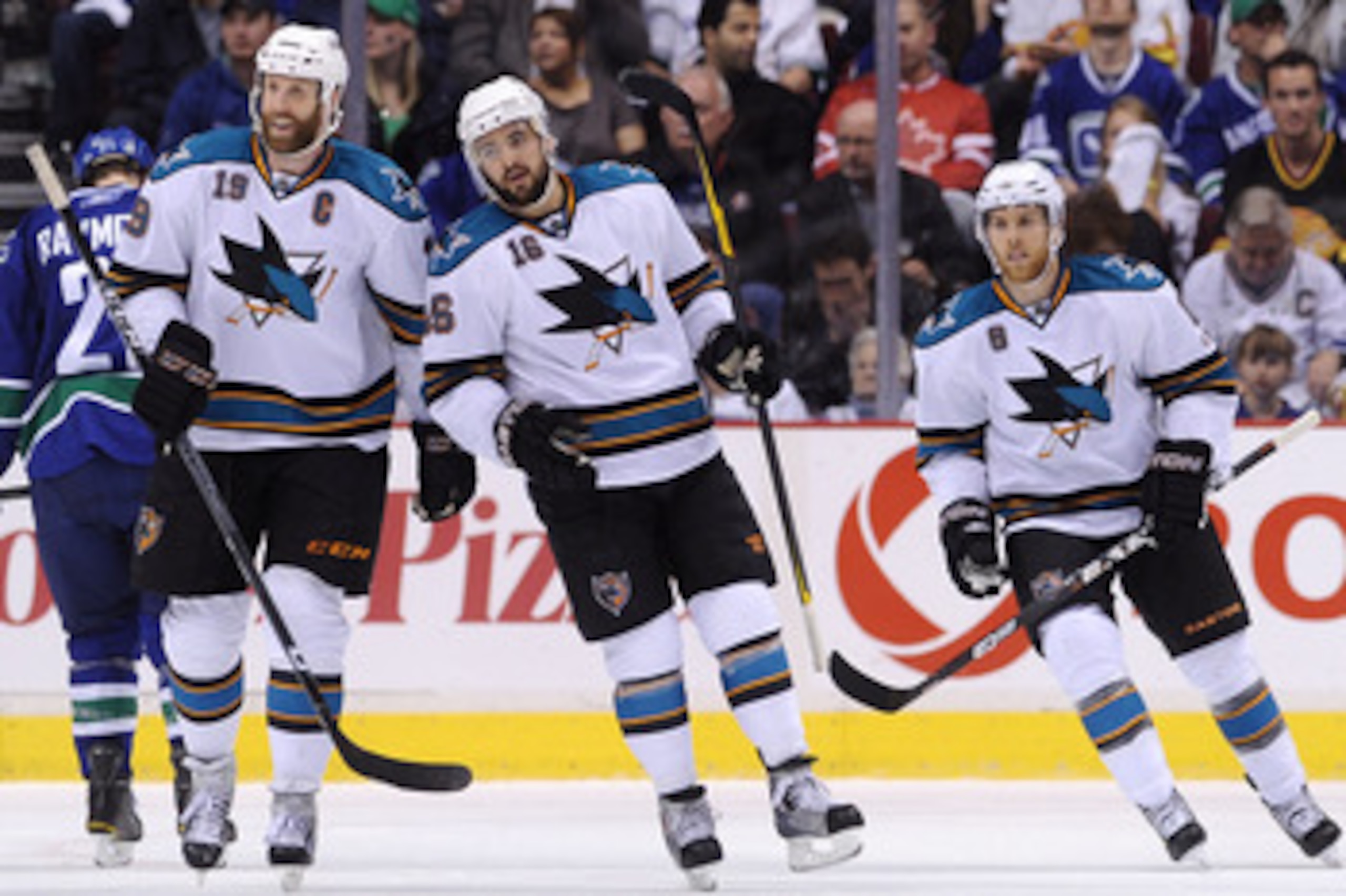 VANCOUVER, CANADA - MAY 24:  (L-R) Joe Thornton #19, Devin Setoguchi #16 and Joe Pavelski #8 of the San Jose Sharks look to celebrate the goal by teammate Patrick Marleau #12 (not in photo)  in Game Five of the Western Conference Finals against the Vancou