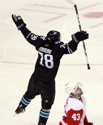 SAN JOSE, CA - APRIL 29:  Benn Ferriero #78 of the San Jose Sharks celebrates in front of Darren Helm #43 of the Detroit Red Wings after he made the winning goal in overtime of Game One of the Western Conference Semifinals during the 2011 NHL Stanley Cup