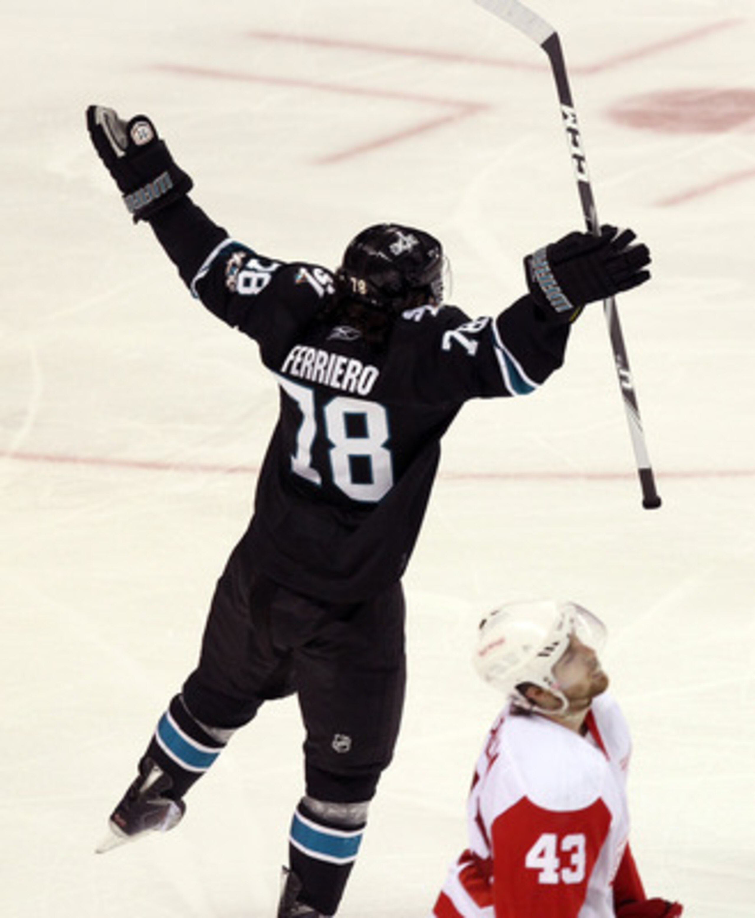 SAN JOSE, CA - APRIL 29:  Benn Ferriero #78 of the San Jose Sharks celebrates in front of Darren Helm #43 of the Detroit Red Wings after he made the winning goal in overtime of Game One of the Western Conference Semifinals during the 2011 NHL Stanley Cup