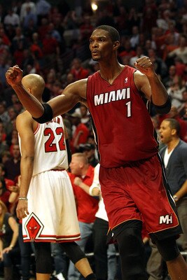 CHICAGO, IL - MAY 26:  Chris Bosh #1 of the Miami Heat celebrates after the Heat won 83-80 against the Chicago Bulls in Game Five of the Eastern Conference Finals during the 2011 NBA Playoffs on May 26, 2011 at the United Center in Chicago, Illinois. NOTE