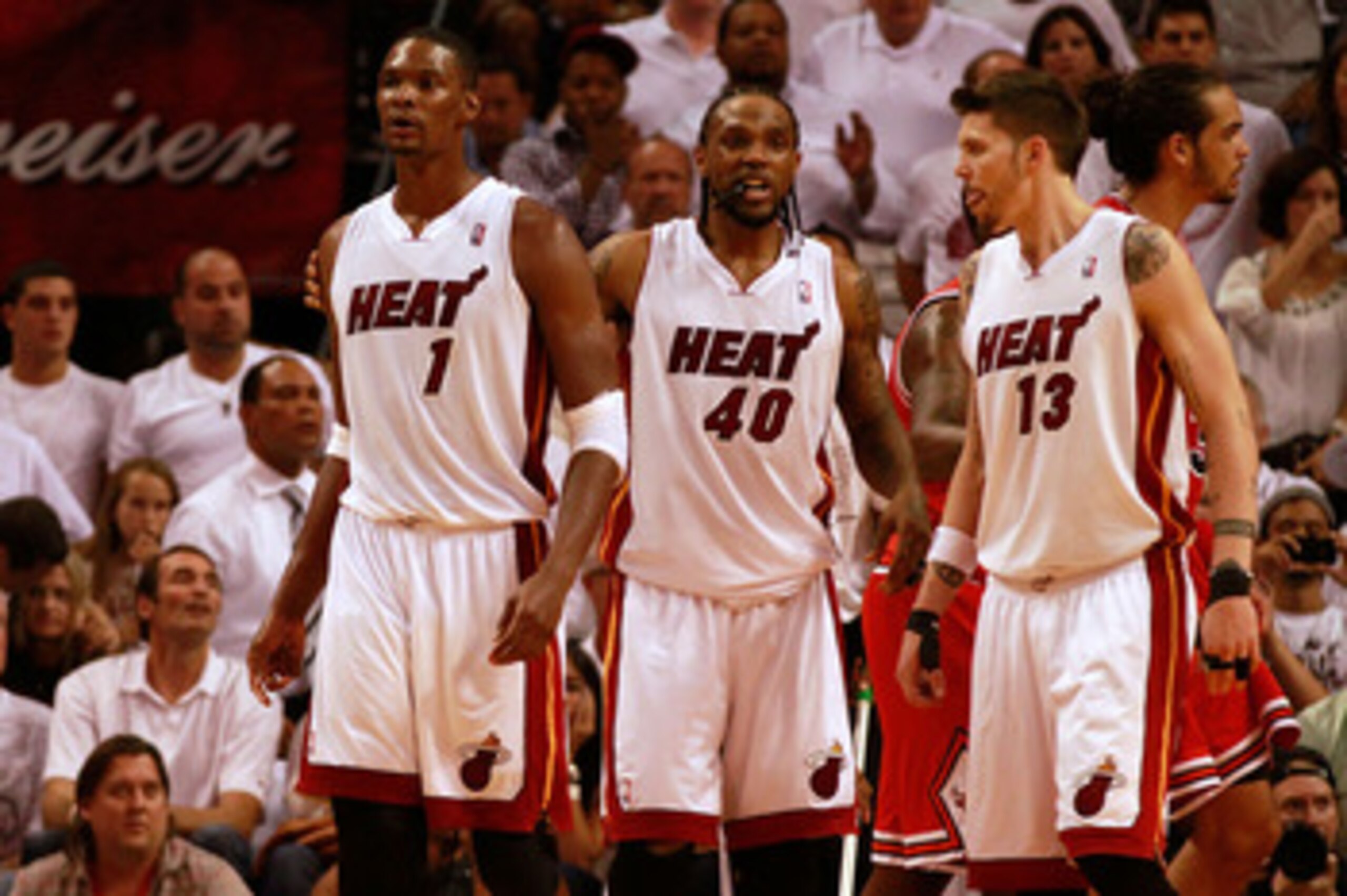 MIAMI, FL - DECEMBER 20:  Chris Bosh #1 of the Miami Heat shoots over Tyson Chandler #6 of the Dallas Mavericks during a game at American Airlines Arena on December 20, 2010 in Miami, Florida. NOTE TO USER: User expressly acknowledges and agrees that, by 