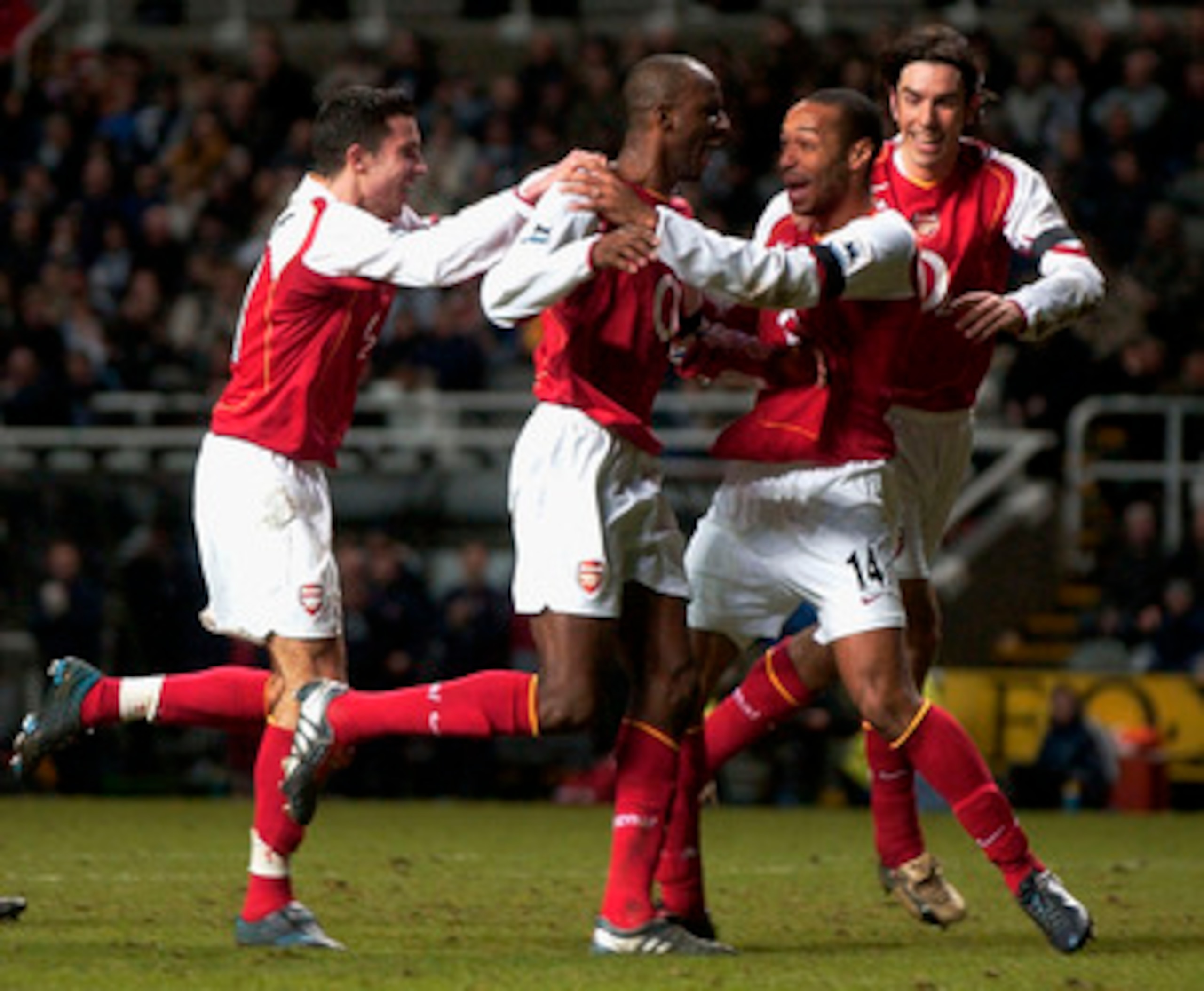 NEWCASTLE, ENGLAND - DECEMBER 29: Thierry Henry of Arsenal congratulates Patrick Vieira on his goal during the FA Barclays Premiership match between Newcastle United and Arsenal at St.James Park on December 29, 2004 in Newcastle, England. (Photo by Matthe