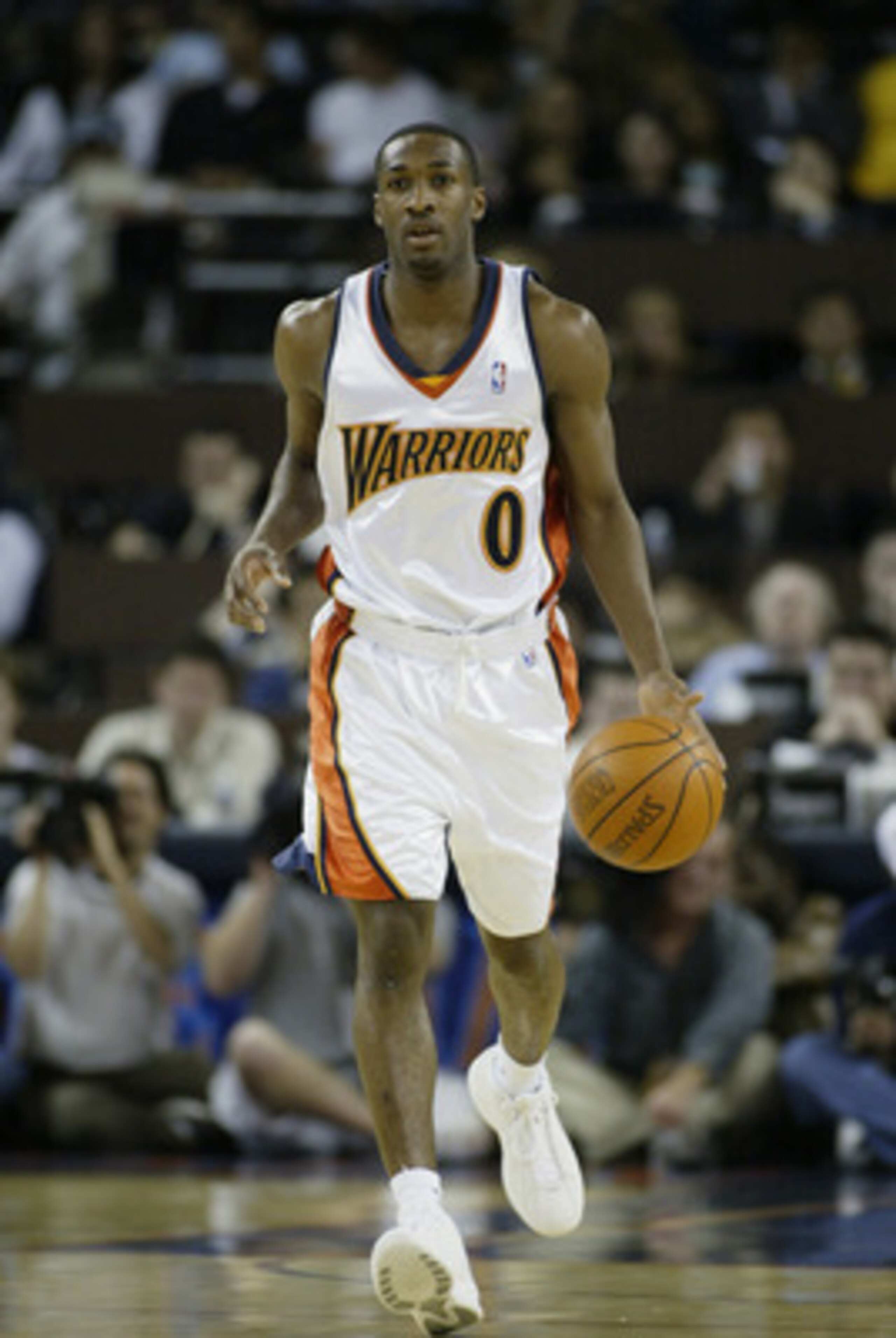 OAKLAND, CA - MARCH 21:  Gilbert Arenas #0 of the Golden State Warriors drives against the Houston Rockets during the game at The Arena in Oakland on March 21, 2003 in Oakland, California.  The Rockets won 117-107.  NOTE TO USER: User expressly acknowledg