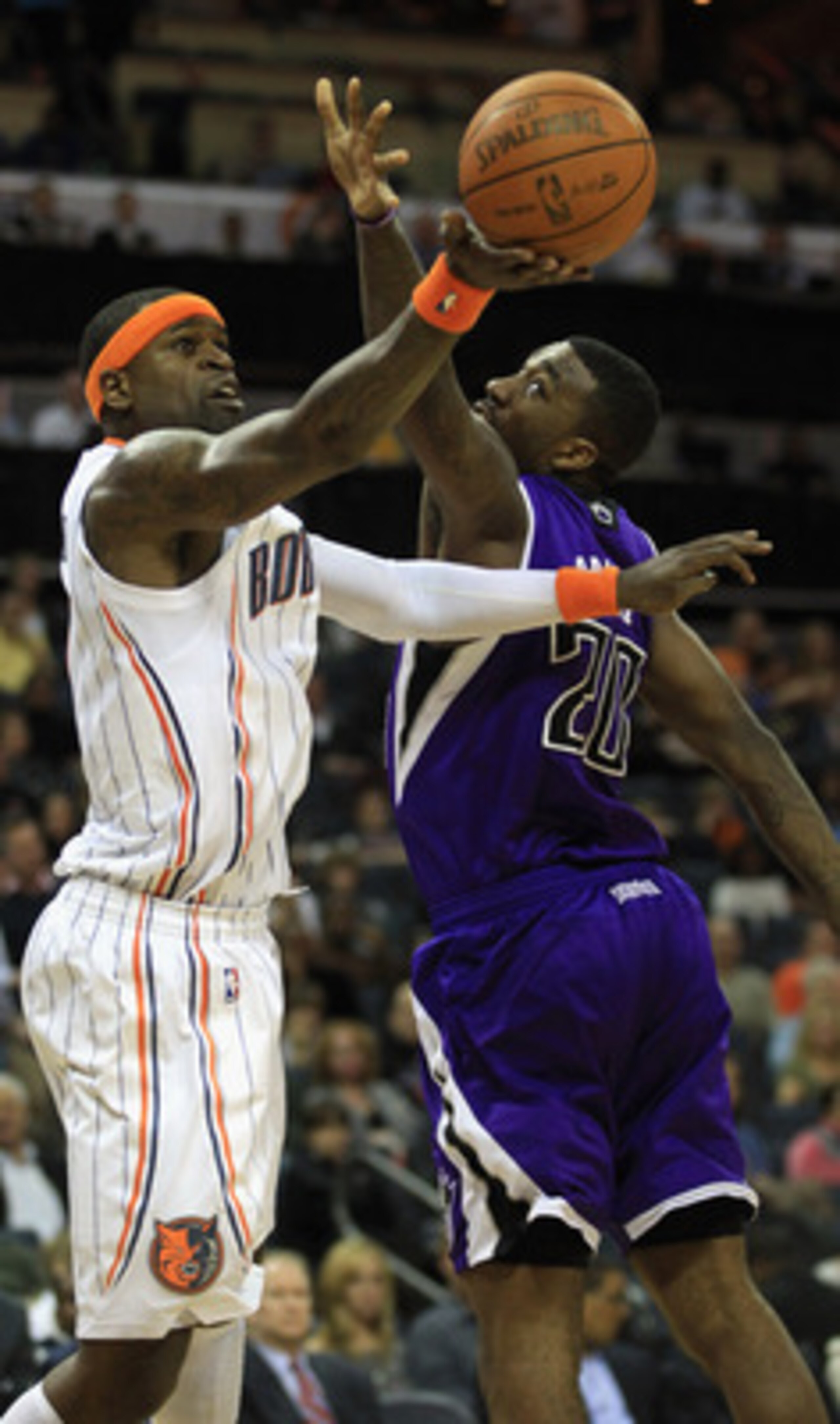 CHARLOTTE, NC - FEBRUARY 25:  Donte Greene #20 of the Sacramento Kings tries to stop Stephen Jackson #1 of the Charlotte Bobcats during their game at Time Warner Cable Arena on February 25, 2011 in Charlotte, North Carolina. NOTE TO USER: User expressly a