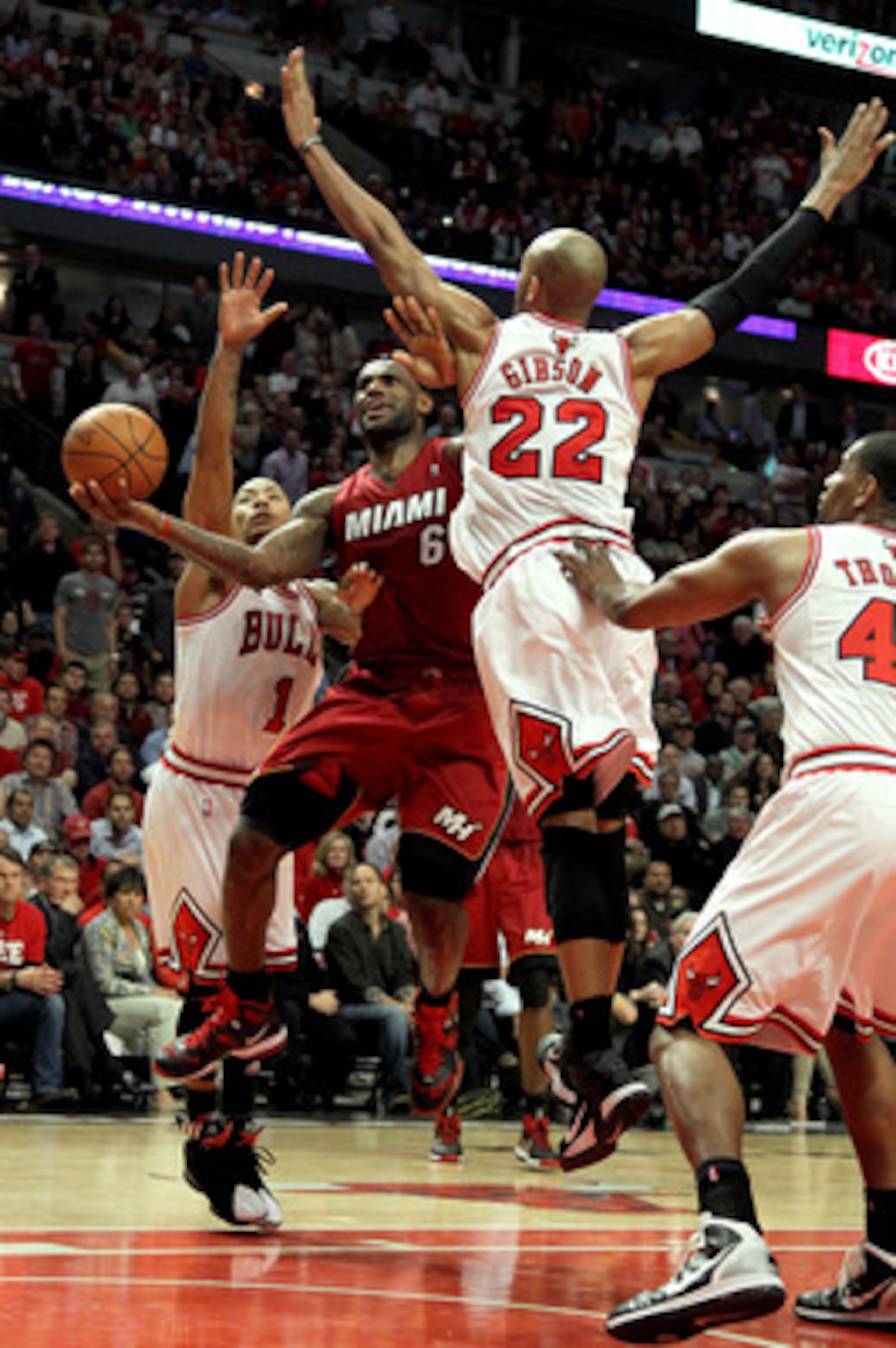 CHICAGO, IL - MAY 26:  LeBron James #6 of the Miami Heat drives for a shot attempt against Taj Gibson #22 and Derrick Rose #1 of the Chicago Bulls in Game Five of the Eastern Conference Finals during the 2011 NBA Playoffs on May 26, 2011 at the United Cen