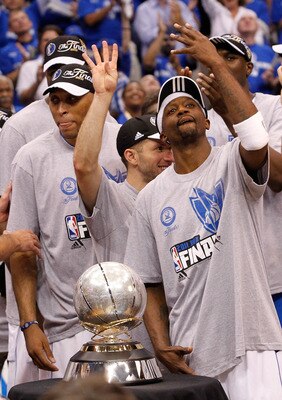 DALLAS, TX - MAY 25:  Jason Terry #31 and Jose Juan Barea #11 and the Dallas Mavericks celebrate their 100-96 victory against the Oklahoma City Thunder in Game Five of the Western Conference Finals during the 2011 NBA Playoffs at American Airlines Center 
