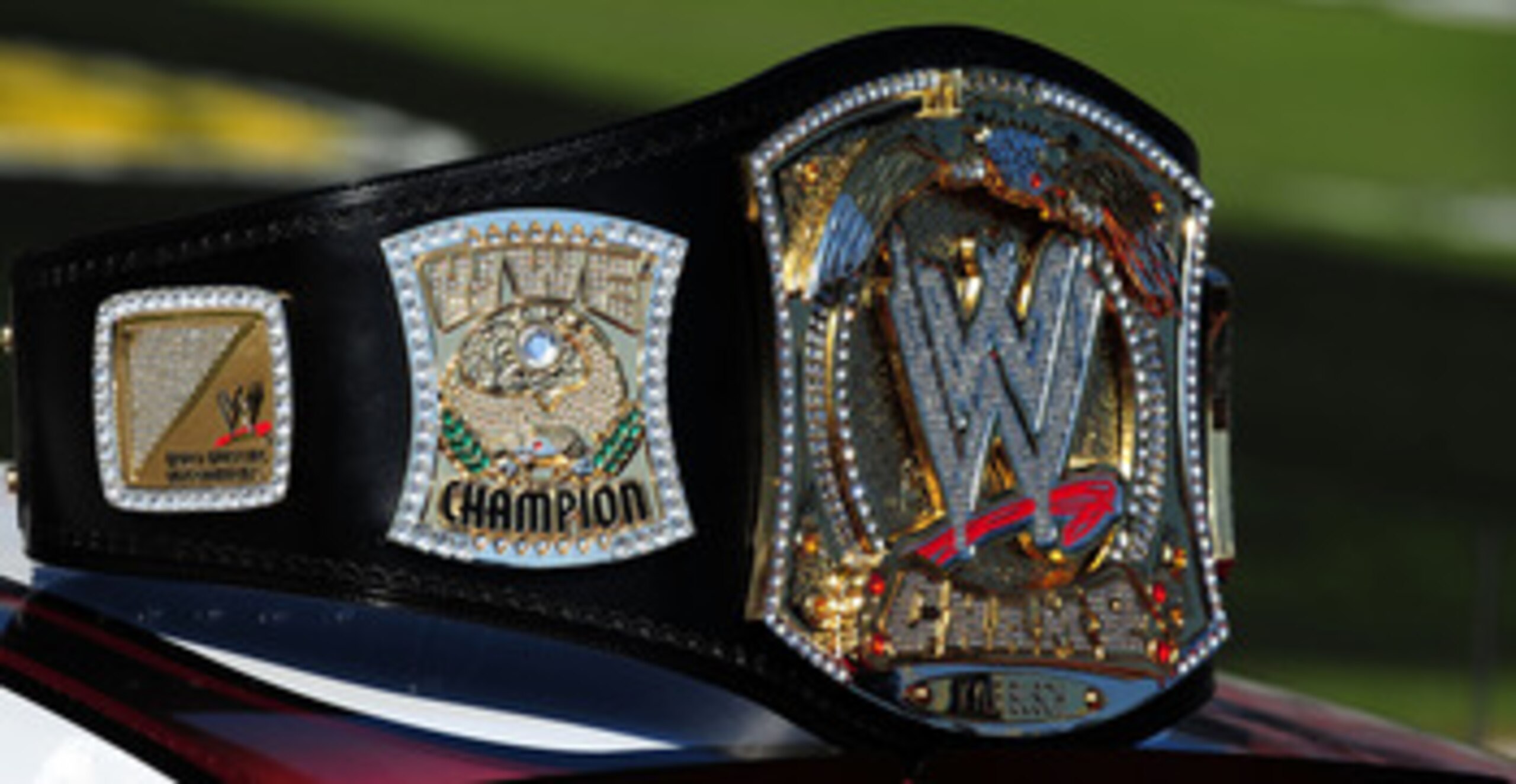 FORT WORTH, TX - NOVEMBER 07: A replica of the WWE world championship belt rests on top of Kyle Busch's #18 Z-Line Designs/WWE Smackdown Toyota prior to the start of the NASCAR Nationwide Series O'Reilly Challenge at Texas Motor Speedway on November 7, 2 FORT WORTH, TX - NOVEMBER 07: A replica of the WWE world championship belt rests on top of Kyle Busch's #18 Z-Line Designs/WWE Smackdown Toyota prior to the start of the NASCAR Nationwide Series O'Reilly Challenge at Texas Motor Speedway on November 7, 2