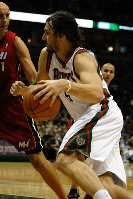 MILWAUKEE, WI - JANUARY 07: Andrew Bogut #6 of the Milwaukee Bucks drives to the basket against the Miami Heat at the Bradley Center on January 7, 2011 in Milwaukee, Wisconsin. NOTE TO USER: User expressly acknowledges and agrees that, by downloading and
