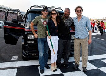 CONCORD, NC - MAY 30:  (L-R) Actors Sharlto Copley, Jessica Biel, Quinton 'Rampage' Jackson and Bradley Cooper pose at the start/finish line prior to the start of the NASCAR Sprint Cup Series Coca-Cola 600 at Charlotte Motor Speedway on May 30, 2010 in Co