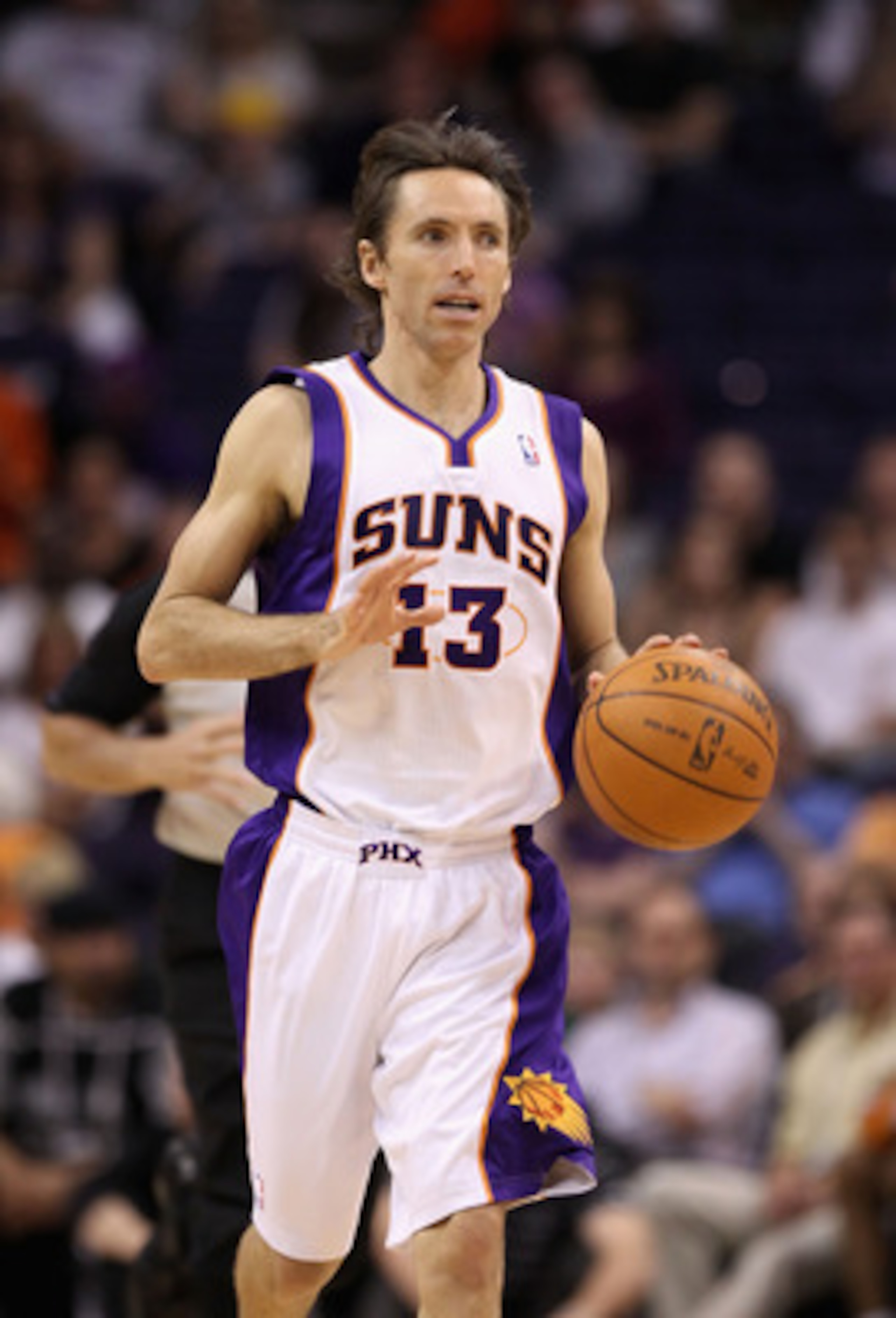 PHOENIX, AZ - MARCH 30:  Steve Nash #13 of the Phoenix Suns in action during the NBA game against the Oklahoma City Thunder at US Airways Center on March 30, 2011 in Phoenix, Arizona. The Thunder defeated the Suns 116-98.  NOTE TO USER: User expressly ack