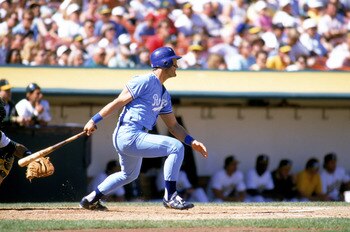 OAKLAND, CA - 1989:  George Brett #5 of the Kansas City Royals watches the flight of the ball as he follows through on his swings during a game against the Oakland Athletics at Oakland-Alameda County Coliseum in 1989 in Oakland, California.  (Photo by Ott