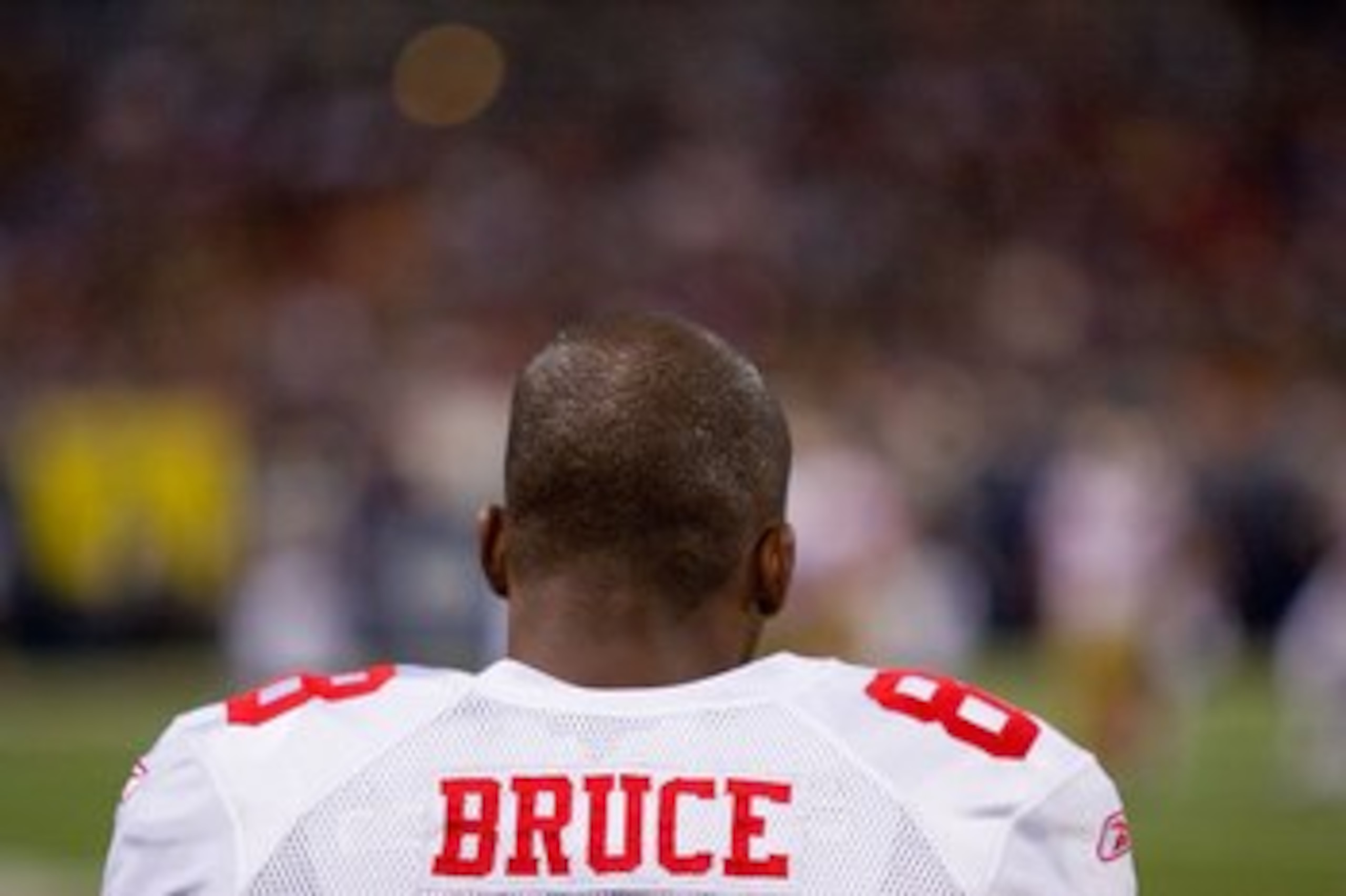 ST. LOUIS - JANUARY 3:  Isaac Bruce #88 of the San Francisco 49ers watches the action from the sidelines during the game against the St. Louis Rams at the Edward Jones Dome on January 3, 2010 in St. Louis, Missouri.  The 49ers beat the Rams 28-6.  (Photo