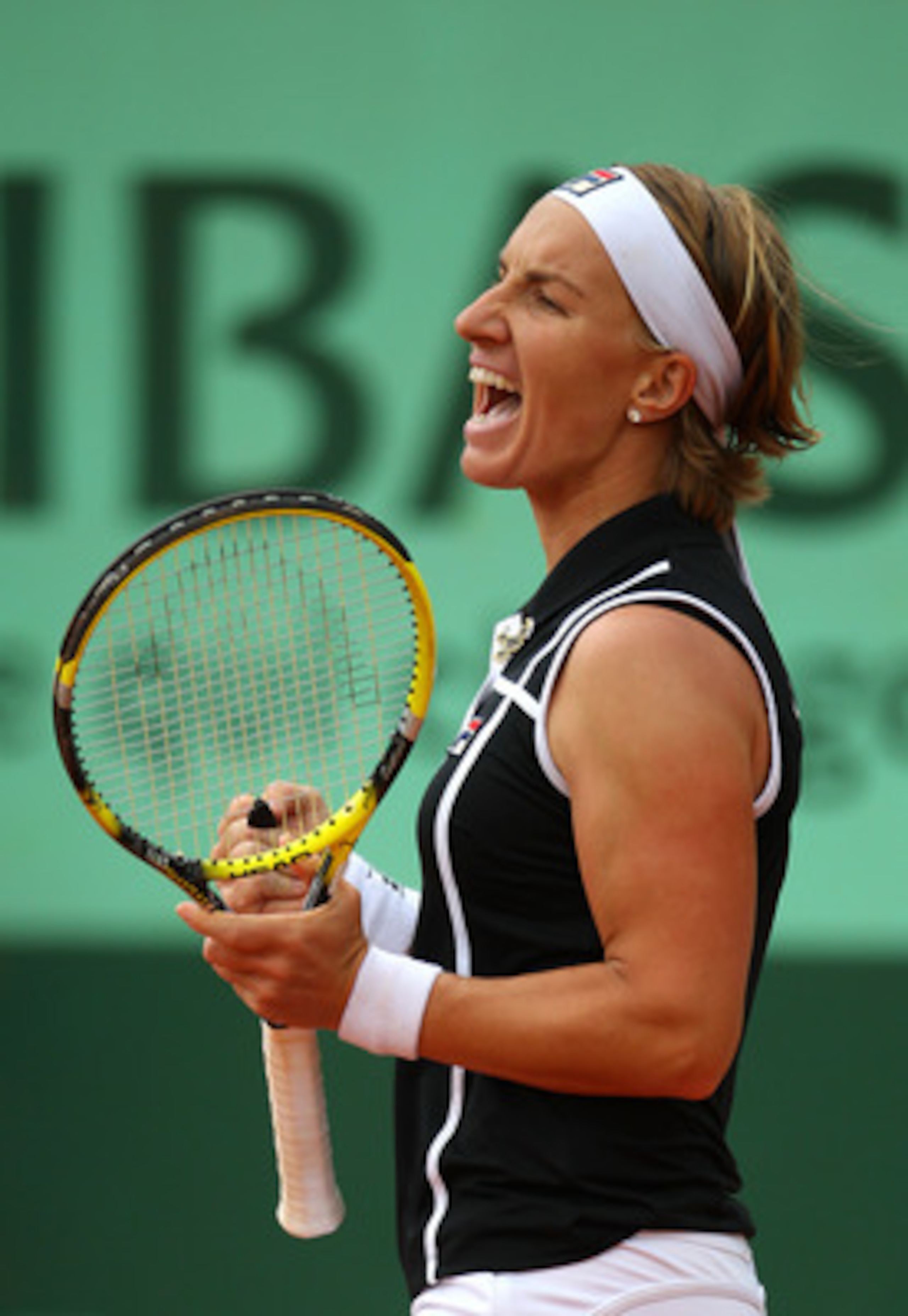 PARIS, FRANCE - MAY 27:  Svetlana Kuznetsova of Russia celebrates matchpoint during the women's singles round three match between Rebecca Marino of Canada and Svetlana Kuznetsova of Russia on day six of the French Open at Roland Garros on May 27, 2011 in 