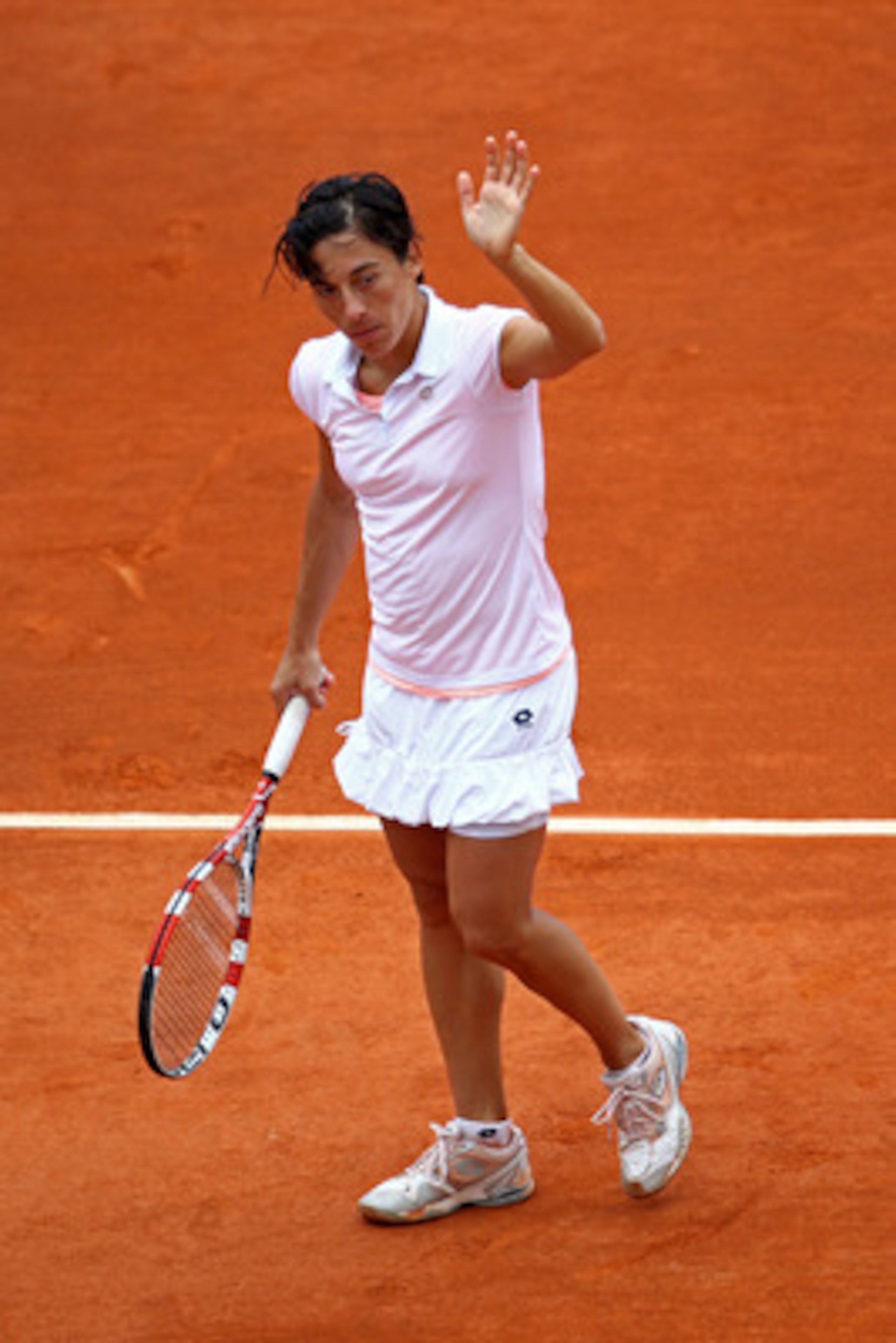 PARIS, FRANCE - MAY 27:   Francesca Schiavone of Italy waves to the fans after Shuai Peng of China withdrew from the match due to medical reasons during the women's singles round three match between Shuai Peng of China and Francesca Schiavone of Italy on 