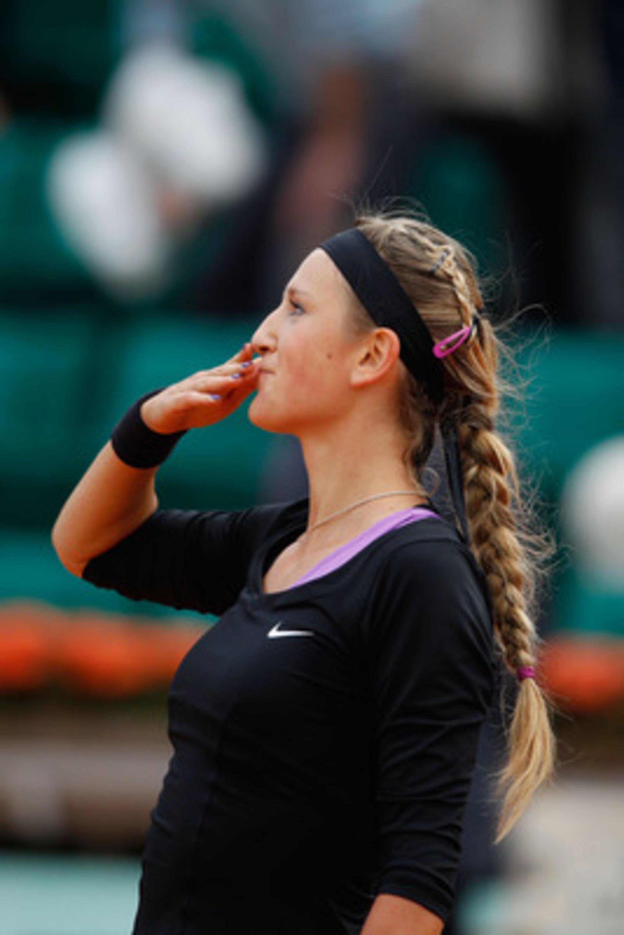 PARIS, FRANCE - MAY 26:  Victoria Azarenka of Belarus blows a kiss to the crowd as she celebrates match point during the women's singles round two match between Pauline Parmentier of France and Victoria Azarenka of Belarus on day five of the French Open a