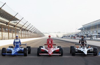 INDIANAPOLIS, IN - MAY 22:  Polesitter Alex Tagliani of Canada, driver of the #77 Bowers & Wilkins/Sam Schmidt Motorsports Dallara Honda, poses on the finish line alongside Scott Dixon of New Zealand, driver of the #9 Target Chip Ganassi Racing Dallara Ho