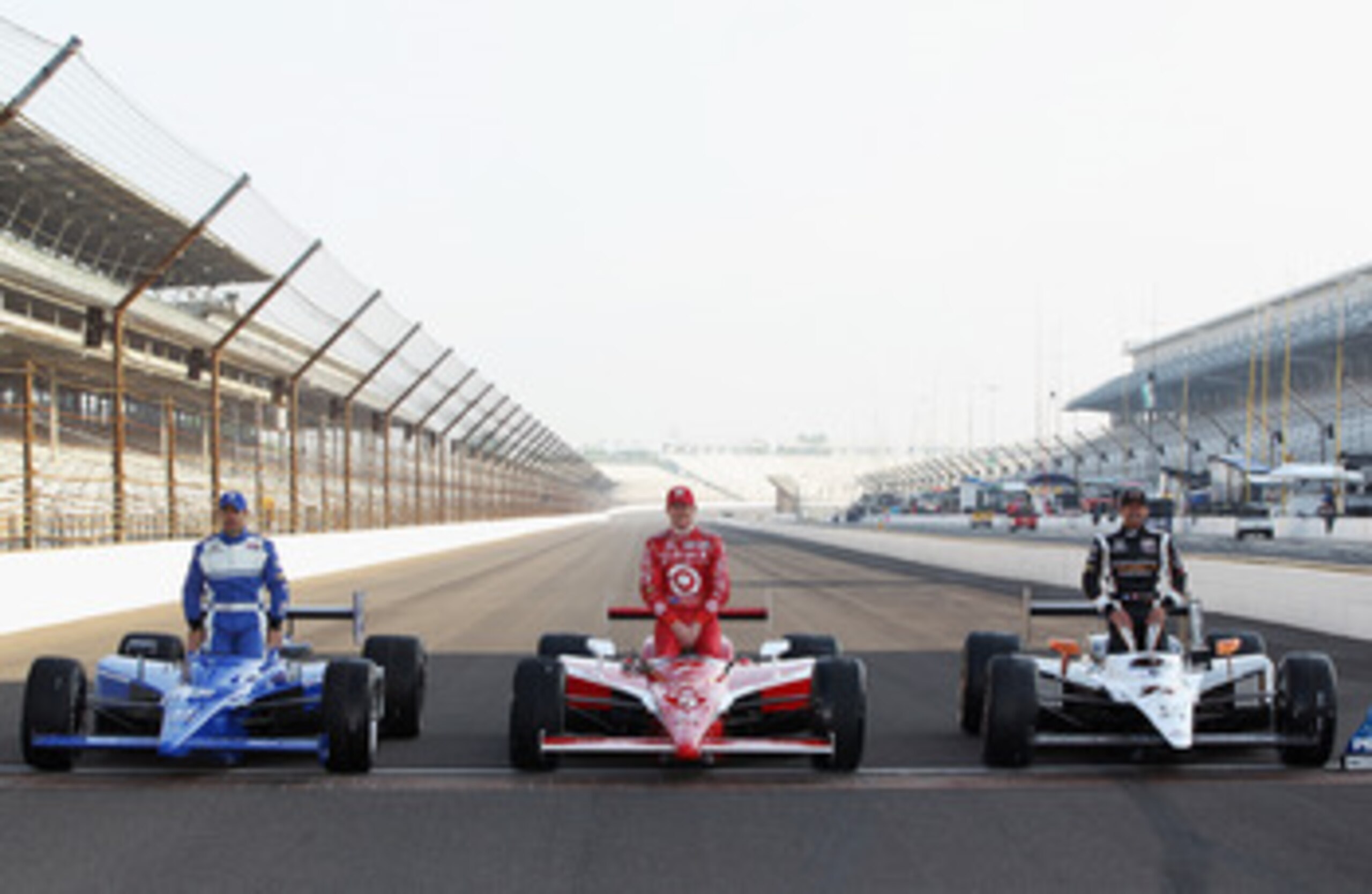 INDIANAPOLIS, IN - MAY 22: Polesitter Alex Tagliani of Canada, driver of the #77 Bowers & Wilkins/Sam Schmidt Motorsports Dallara Honda, poses on the finish line alongside Scott Dixon of New Zealand, driver of the #9 Target Chip Ganassi Racing Dallara Ho INDIANAPOLIS, IN - MAY 22: Polesitter Alex Tagliani of Canada, driver of the #77 Bowers & Wilkins/Sam Schmidt Motorsports Dallara Honda, poses on the finish line alongside Scott Dixon of New Zealand, driver of the #9 Target Chip Ganassi Racing Dallara Ho