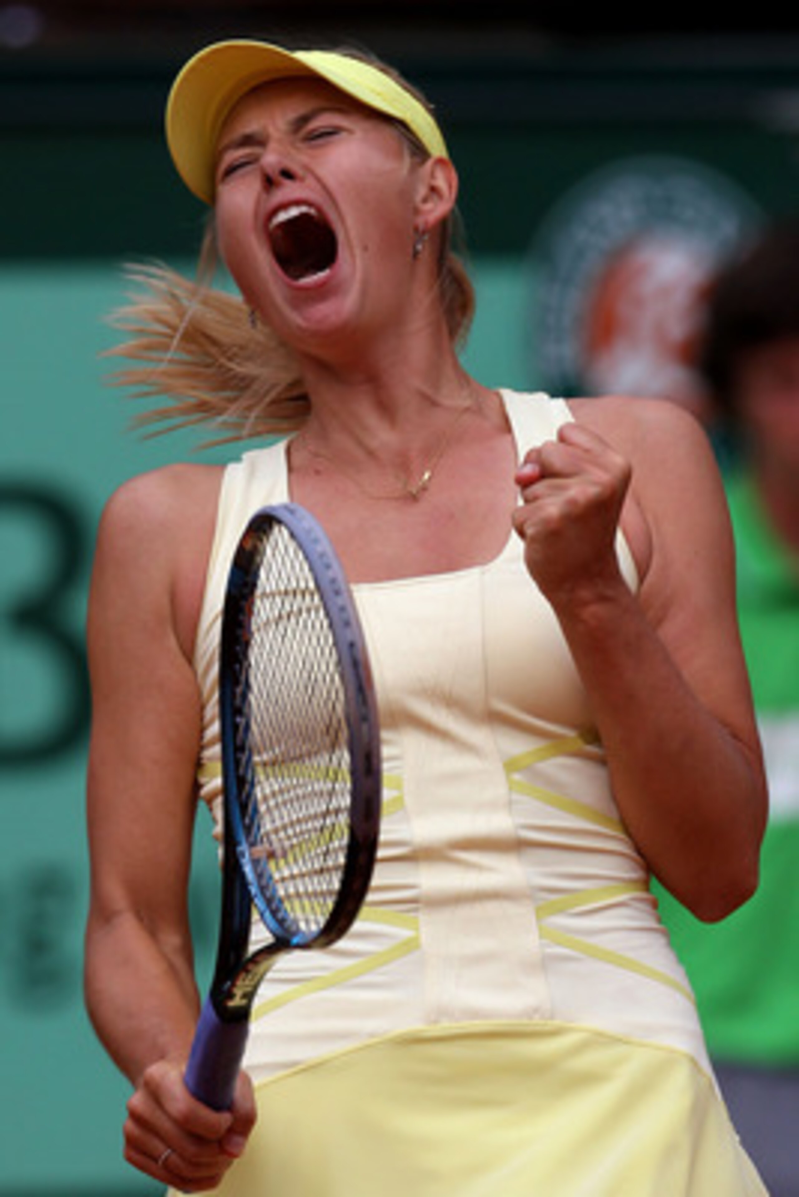 PARIS, FRANCE - MAY 26:  Maria Sharapova of Russia celebrates after winning the second set during the women's singles round two match between Maria Sharapova of Russia and Caroline Garcia of France on day five of the French Open at Roland Garros on May 26