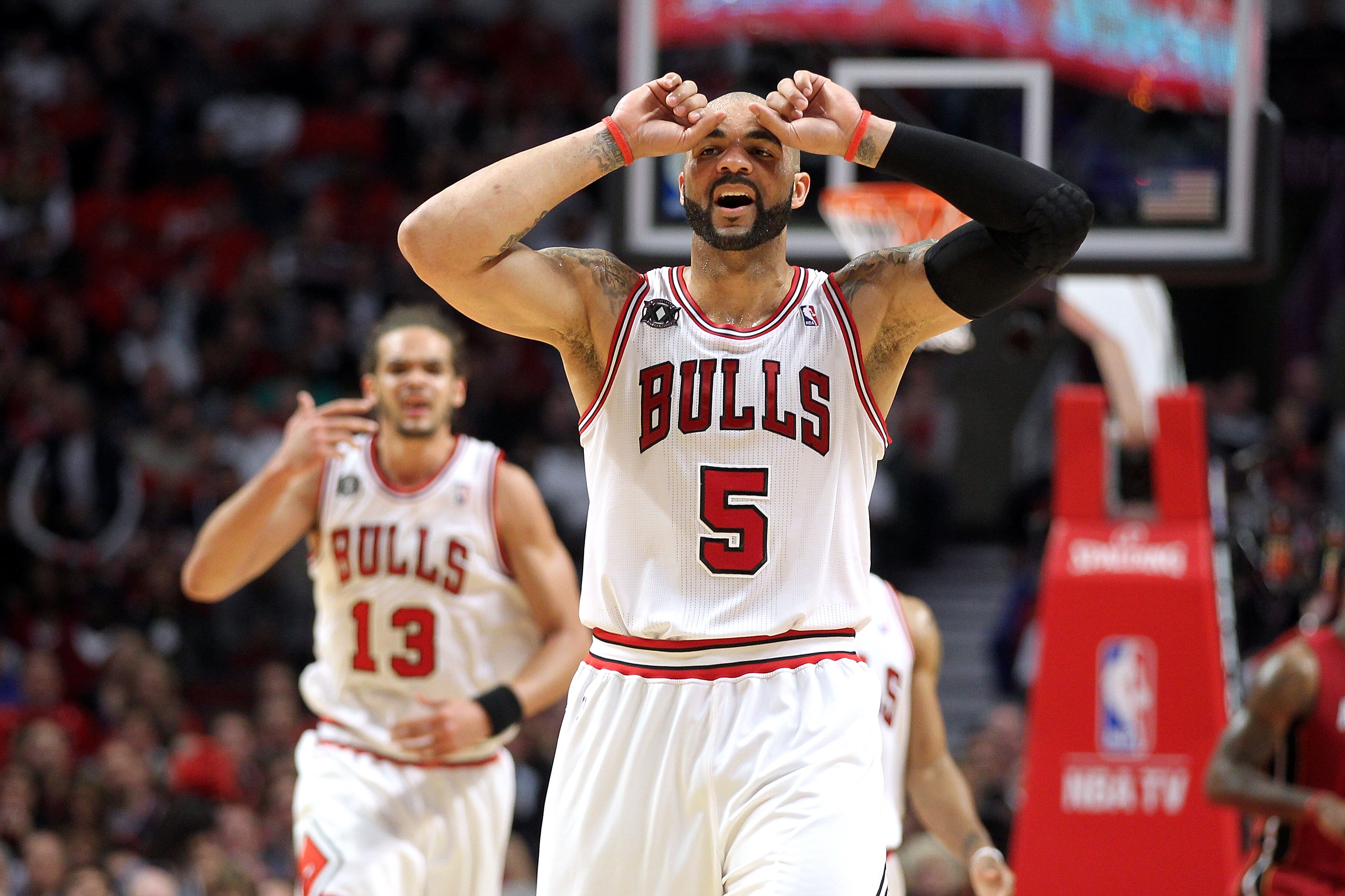 CHICAGO, IL - MAY 26:  Carlos Boozer #5 and Joakim Noah #13 of the Chicago Bulls looks on against the Miami Heat in Game Five of the Eastern Conference Finals during the 2011 NBA Playoffs on May 26, 2011 at the United Center in Chicago, Illinois. The Heat