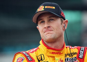 INDIANAPOLIS, IN - MAY 22:  Ryan Hunter-Reay, driver of the #26 Team DHL/Sun Drop Citrus Soda Dallara Honda, watches the scoreboard as he waits to qualify for the Indianapolis 500 on May 22, 2011 at Indianapolis Motor Speedway in Indianapolis, Indiana.  (