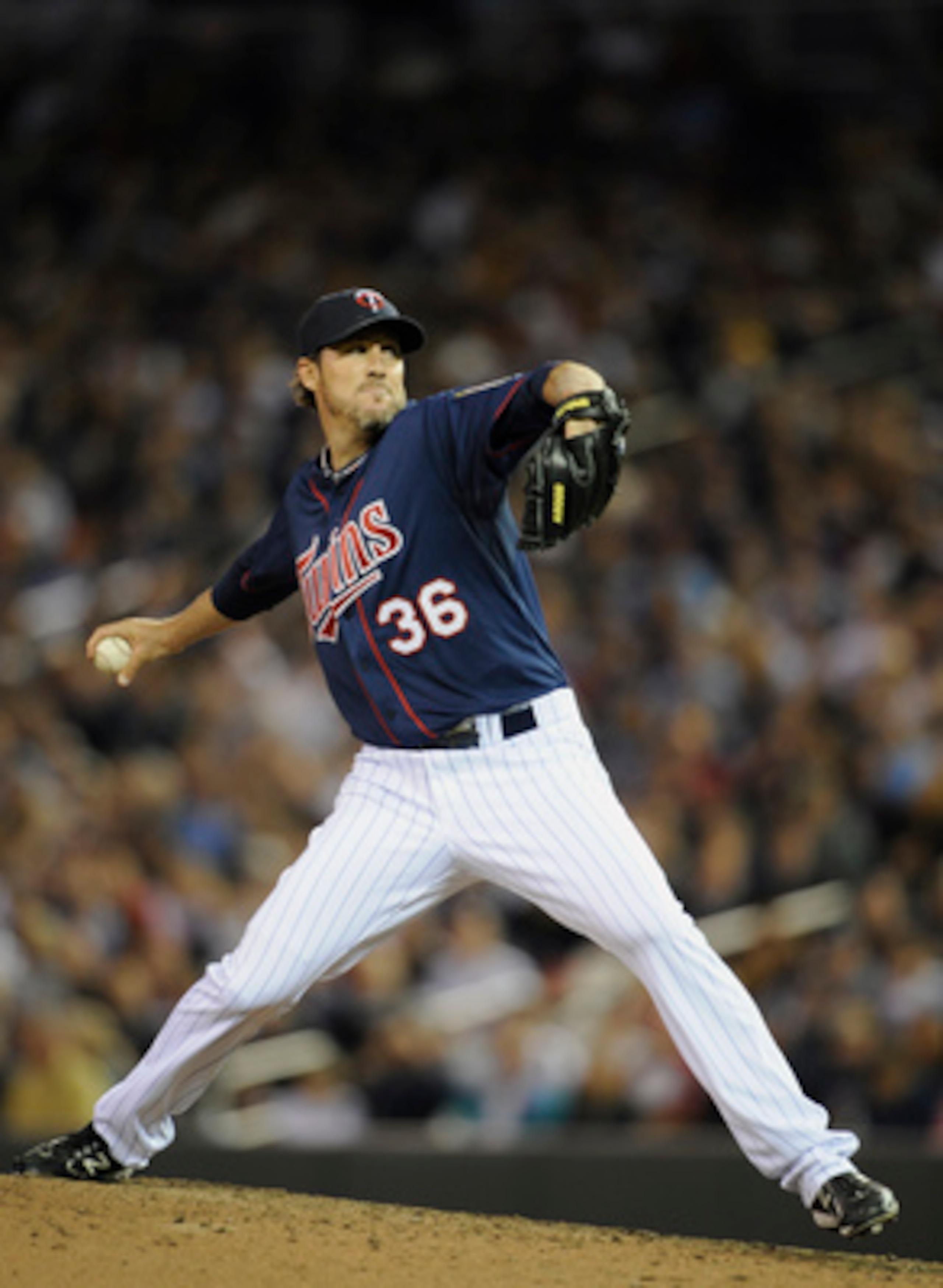 MINNEAPOLIS, MN - APRIL 12: Joe Nathan #36 of the Minnesota Twins pitches against the Kansas City Royals during the ninth inning of their game on April 12, 2011 at Target Field in Minneapolis, Minnesota. Twins defeated the Royals 4-3 in ten innings. (Phot