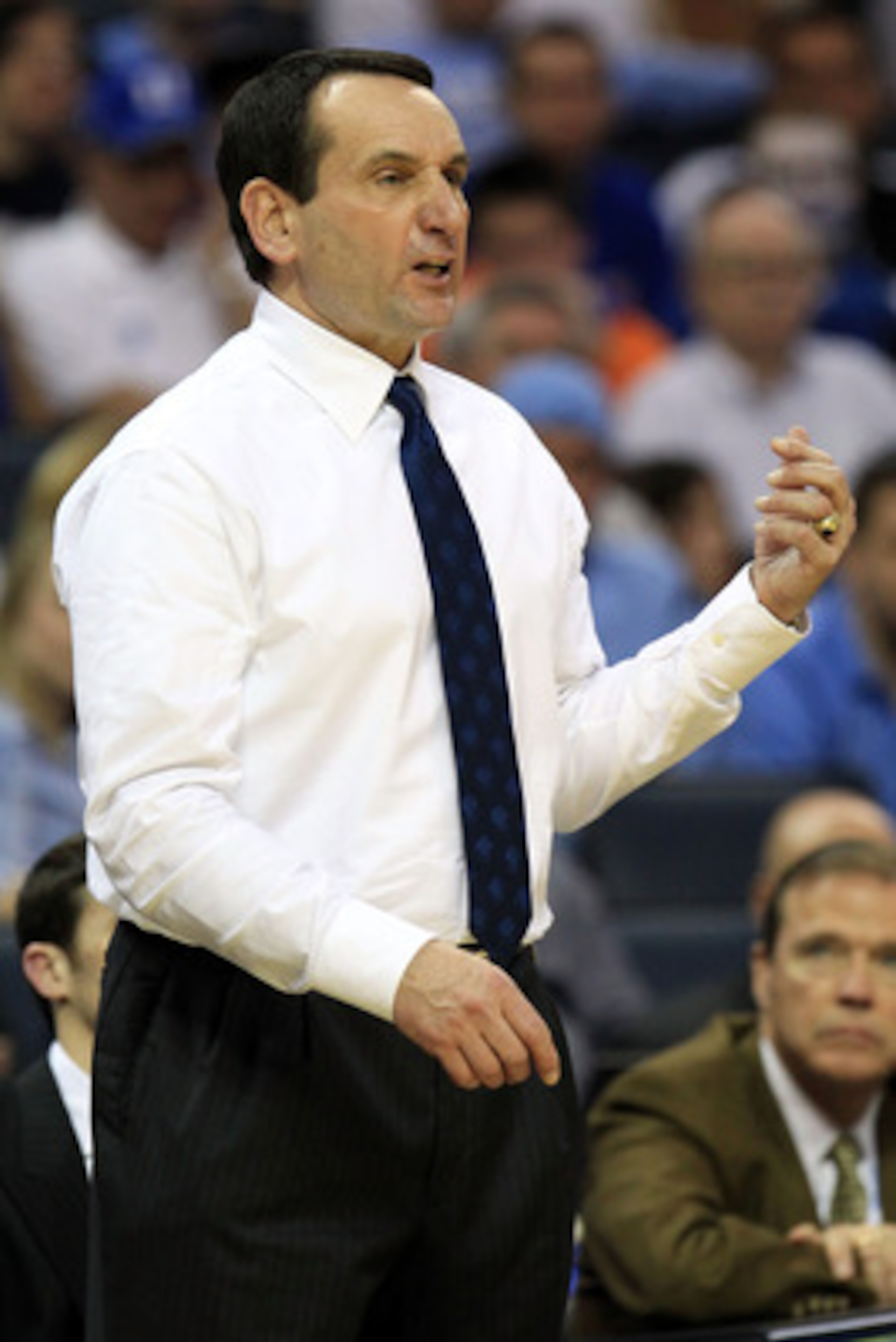 CHARLOTTE, NC - MARCH 20: Head coach Mike Krzyzewski of the Duke Blue Devils reacts while taking on the Michigan Wolverines during the third round of the 2011 NCAA men's basketball tournament at Time Warner Cable Arena on March 20, 2011 in Charlotte, Nor CHARLOTTE, NC - MARCH 20: Head coach Mike Krzyzewski of the Duke Blue Devils reacts while taking on the Michigan Wolverines during the third round of the 2011 NCAA men's basketball tournament at Time Warner Cable Arena on March 20, 2011 in Charlotte, Nor