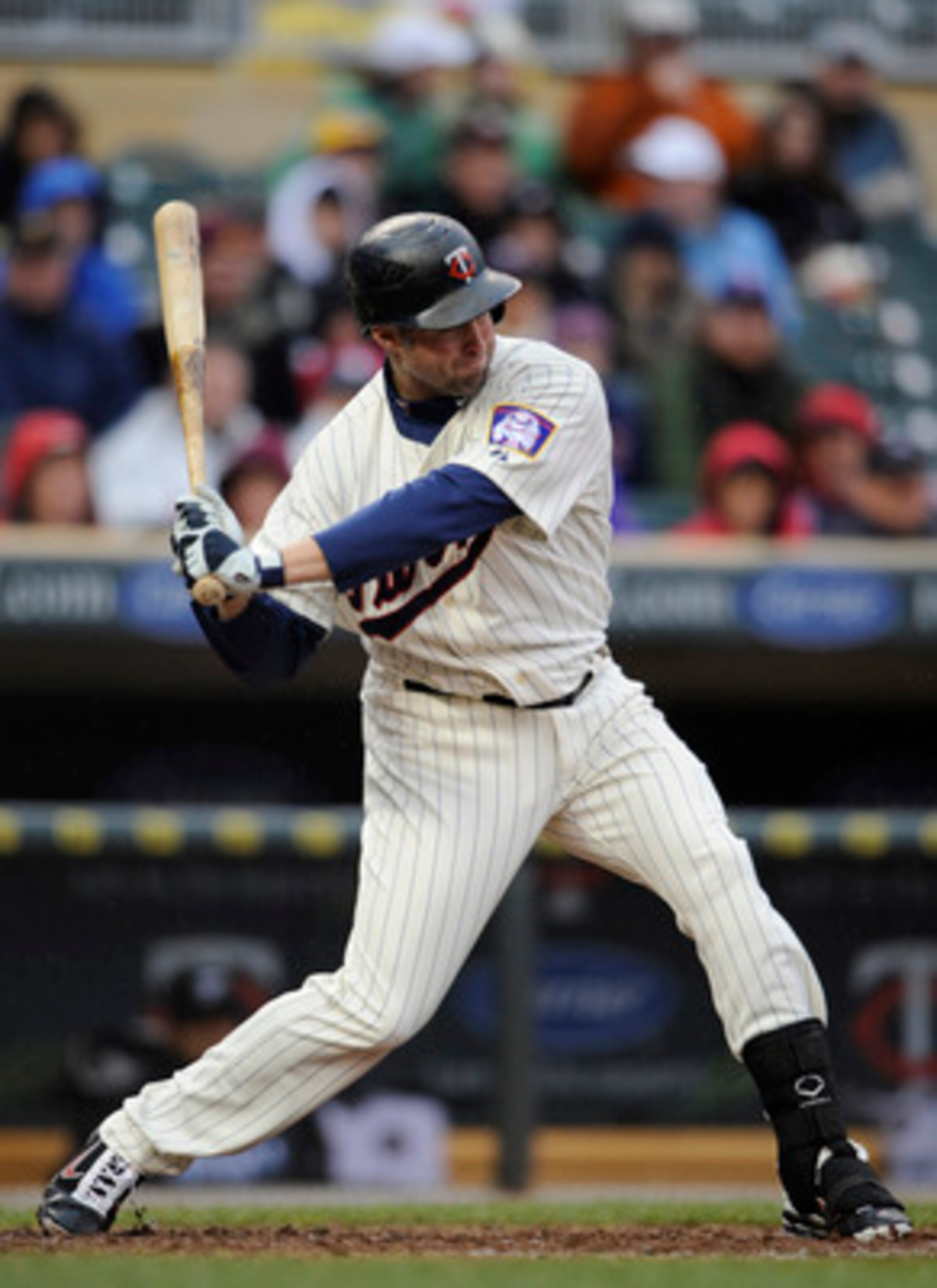MINNEAPOLIS, MN - MAY 14: Michael Cuddyer #5 of the Minnesota Twins hits a solo home run against the Toronto Blue Jays in the sixth inning on May 14, 2011 at Target Field in Minneapolis, Minnesota. Blue Jays defeated the Twins 9-3 in eleven innings. (Phot
