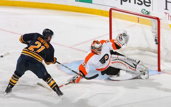 BUFFALO, NY - APRIL 24: Brian Boucher #33 of the Philadelphia Flyers stops Drew Stafford #21 of the Buffalo Sabres in the third period  in Game Six of the Eastern Conference Quarterfinals during the 2011 NHL Stanley Cup Playoffs at HSBC Arena at HSBC Aren