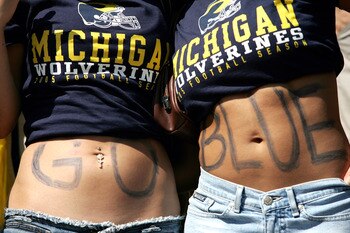 ANN ARBOR, MI - SEPTEMBER 10: Michigan Wolverines fans spell out 'Go Blue' on their stomacsh during the game against the Notre Dame Fighting Irish on September 10, 2005 at Michigan Stadium in Ann Arbor, Michigan.  (Photo by Jonathan Ferrey/Getty Images)
