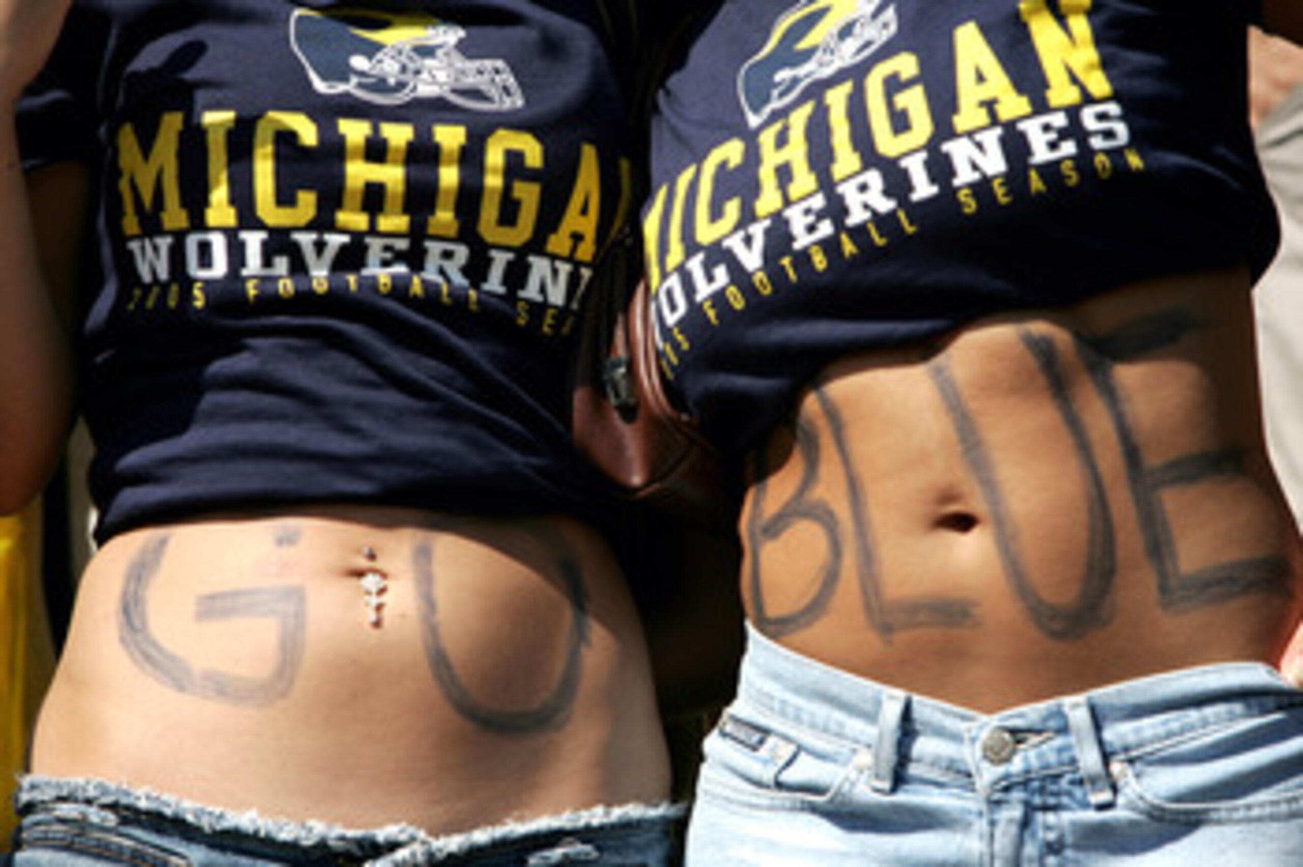 ANN ARBOR, MI - SEPTEMBER 10: Michigan Wolverines fans spell out 'Go Blue' on their stomacsh during the game against the Notre Dame Fighting Irish on September 10, 2005 at Michigan Stadium in Ann Arbor, Michigan.  (Photo by Jonathan Ferrey/Getty Images)