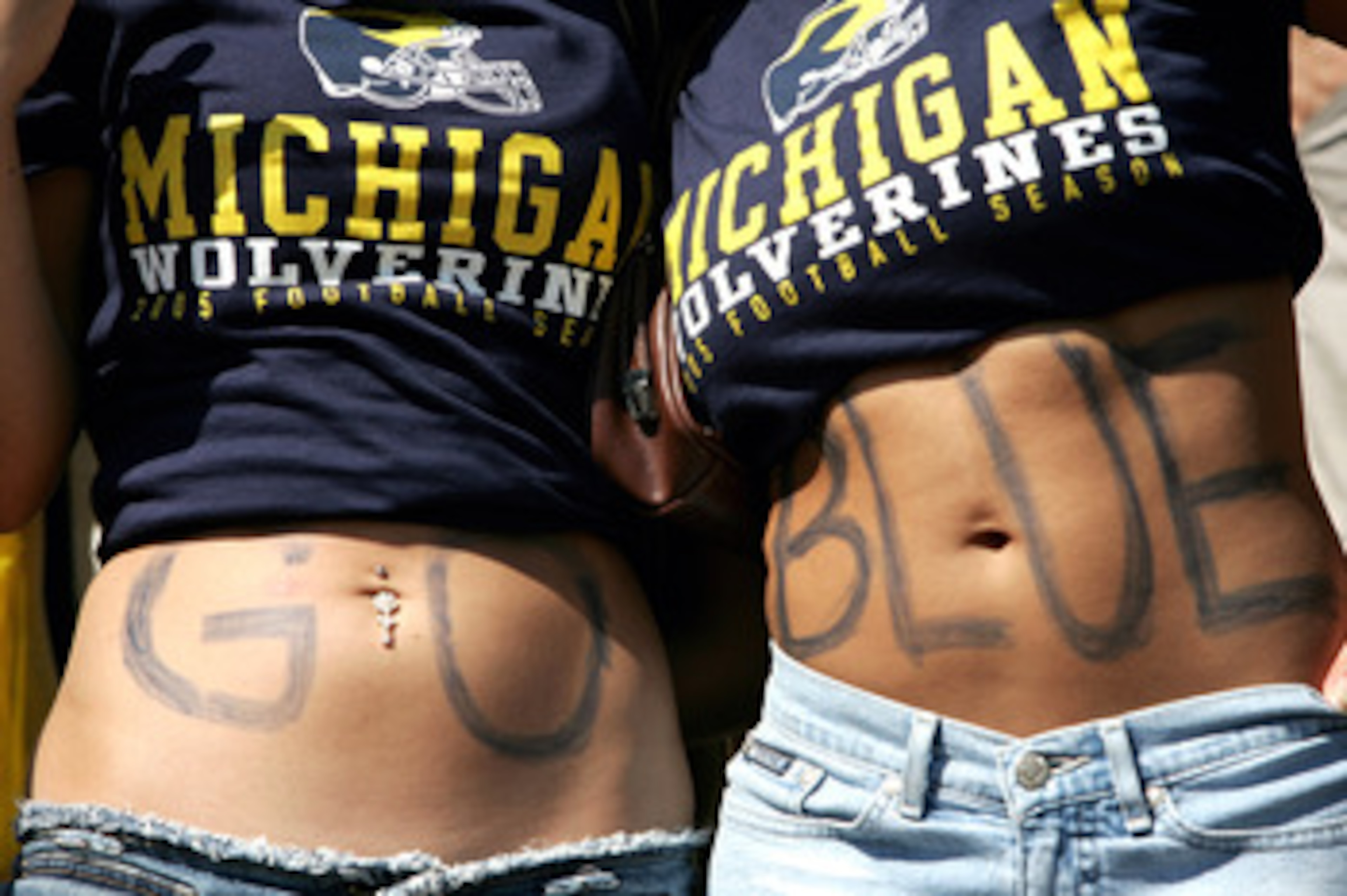 ANN ARBOR, MI - SEPTEMBER 10: Michigan Wolverines fans spell out 'Go Blue' on their stomacsh during the game against the Notre Dame Fighting Irish on September 10, 2005 at Michigan Stadium in Ann Arbor, Michigan.  (Photo by Jonathan Ferrey/Getty Images)