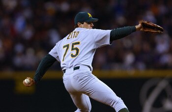 SEATTLE - SEPTEMBER 24:  Starting Pitcher Barry Zito #75 of the Oakland A's delivers a pitch against the Seattle Mariners during the game on September 24, 2002 at Safeco Field in Seattle, Washington.  The Mariners defeated the A's 8-7.  (Photo by Otto Gre