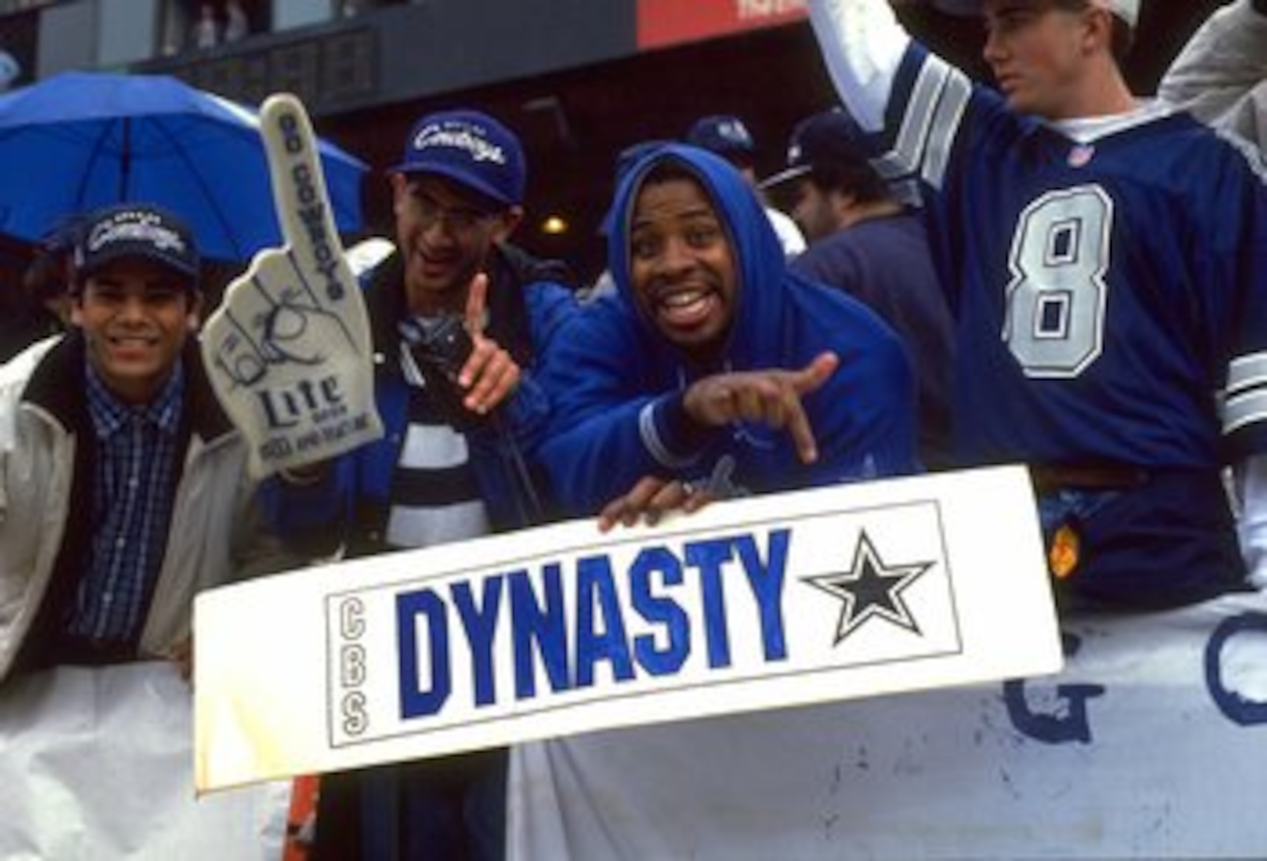 17 JAN 1993:  DALLAS COWBOYS FANS SUPPORT THEIR TEAM BY HOLDING UP A 'DYNASTY' POSTER DURING THE COWBOYS 30-20 NFC CHAMPIONSHIP GAME WIN OVER THE SAN FRANCISCO 49ERS AT CANDLESTICK PARK IN SAN FRANCISCO, CALIFORNIA.